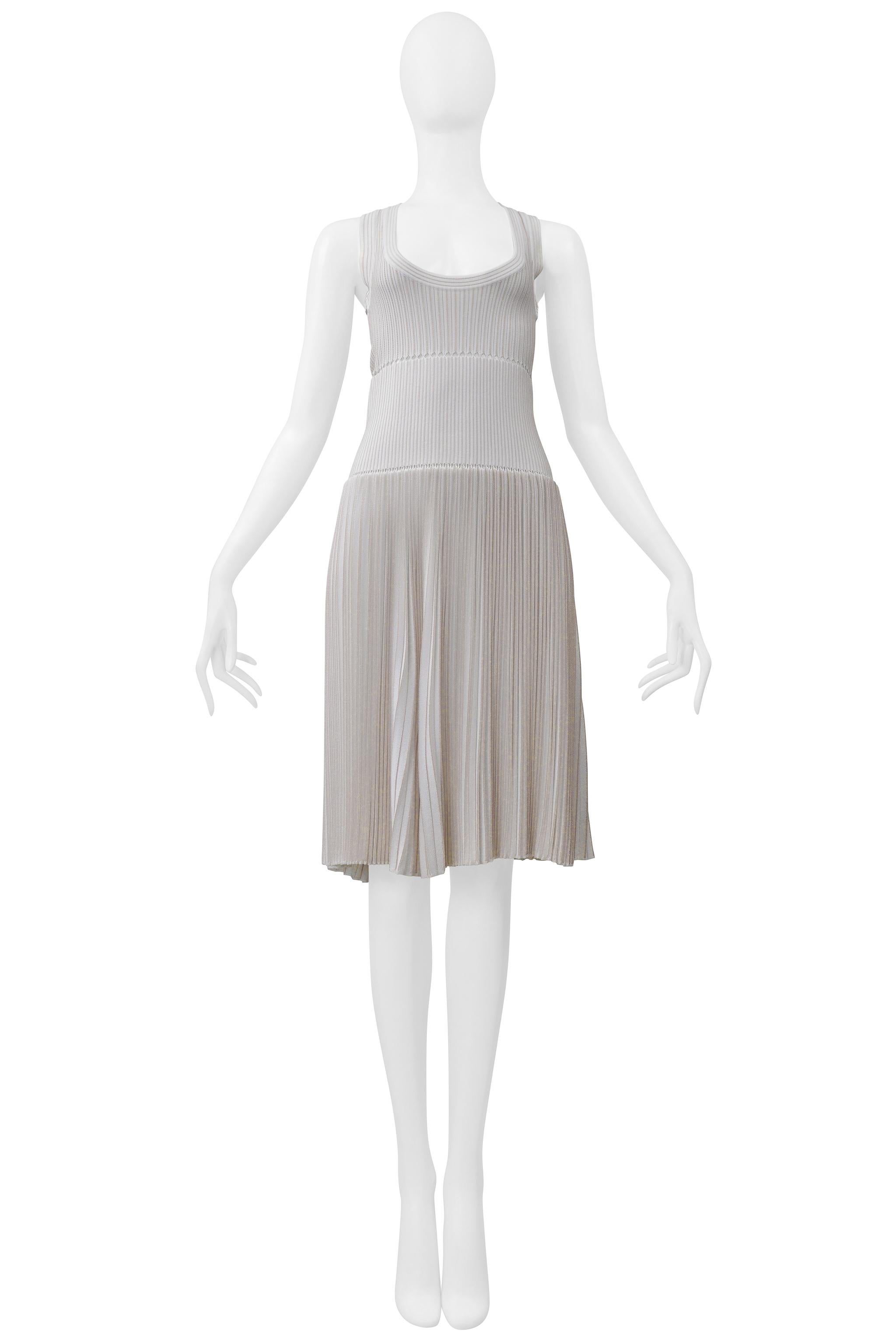 Resurrection Vintage is excited to offer a vintage Azzedine Alaia white laser-cut fancy knit dress featuring a scoop neck, fitted torso, tank sleeves, pleated circle skirt with laser cutouts, and a center-back zipper. 


Alaia
Size: 40
Fabric: 80%