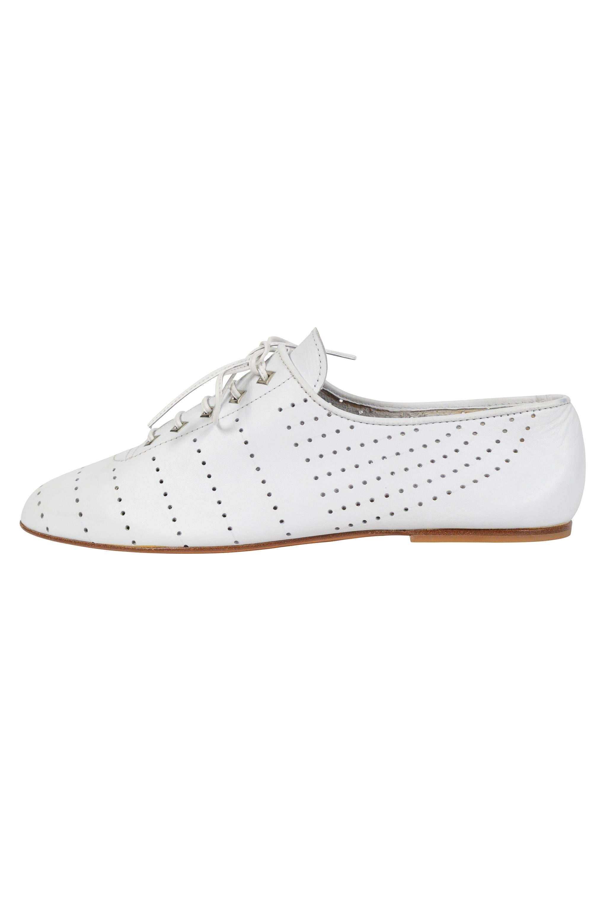 Resurrection Vintage is excited to offer a pair of vintage Azzedine Alaia white leather perforated shoes featuring diamond metal grommets and leather laces. 

Azzedine Alaia Paris For Diego Della Valle
Size 38.5
Leather
Circa Late 1980s
Excellent