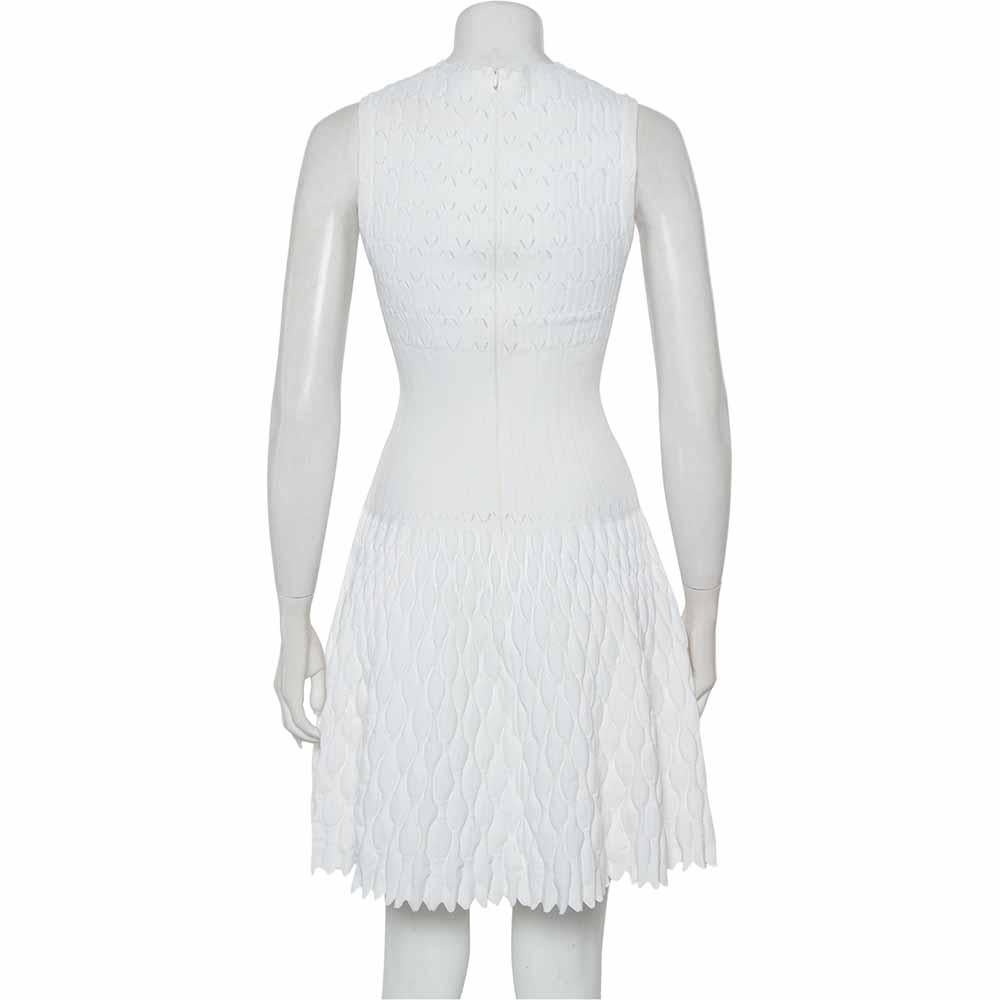 This dress by Alaia features a gorgeous design making it a must-have item in your closet. White in hue, it features scalloped trims and a simple skirt cut to a short hem. This knit dress enhances your look and keeps you at your stunning best