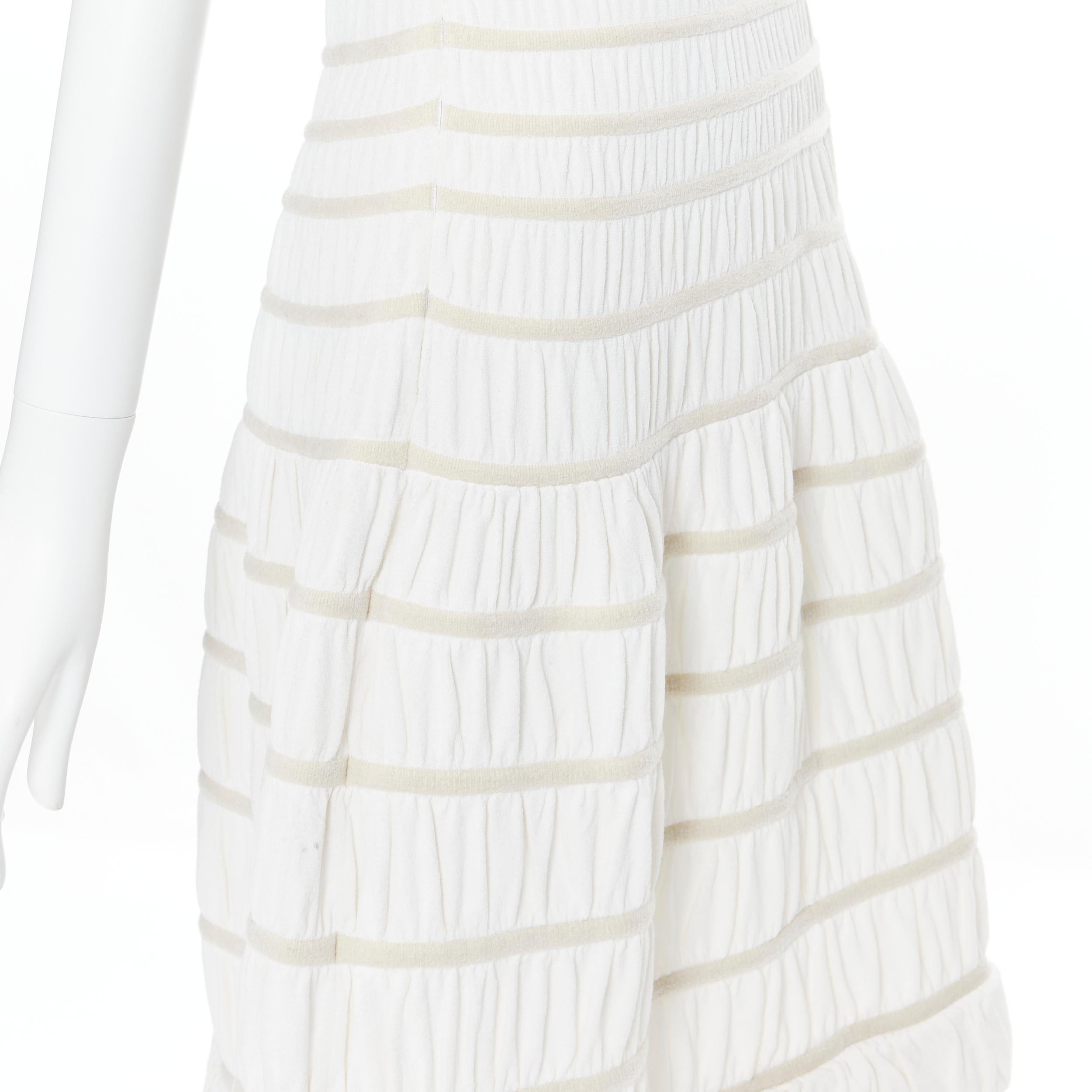 ALAIA white viscose beige ribbed cloque fit flare cocktail dress S 
Reference: AEMA/A00033 
Brand: Alaia 
Designer: Azzedine Alaia 
Material: Viscose 
Color: White 
Pattern: Solid 
Extra Detail: Boat neck. Fluffy ribbed trimming. Cloque fabrication.