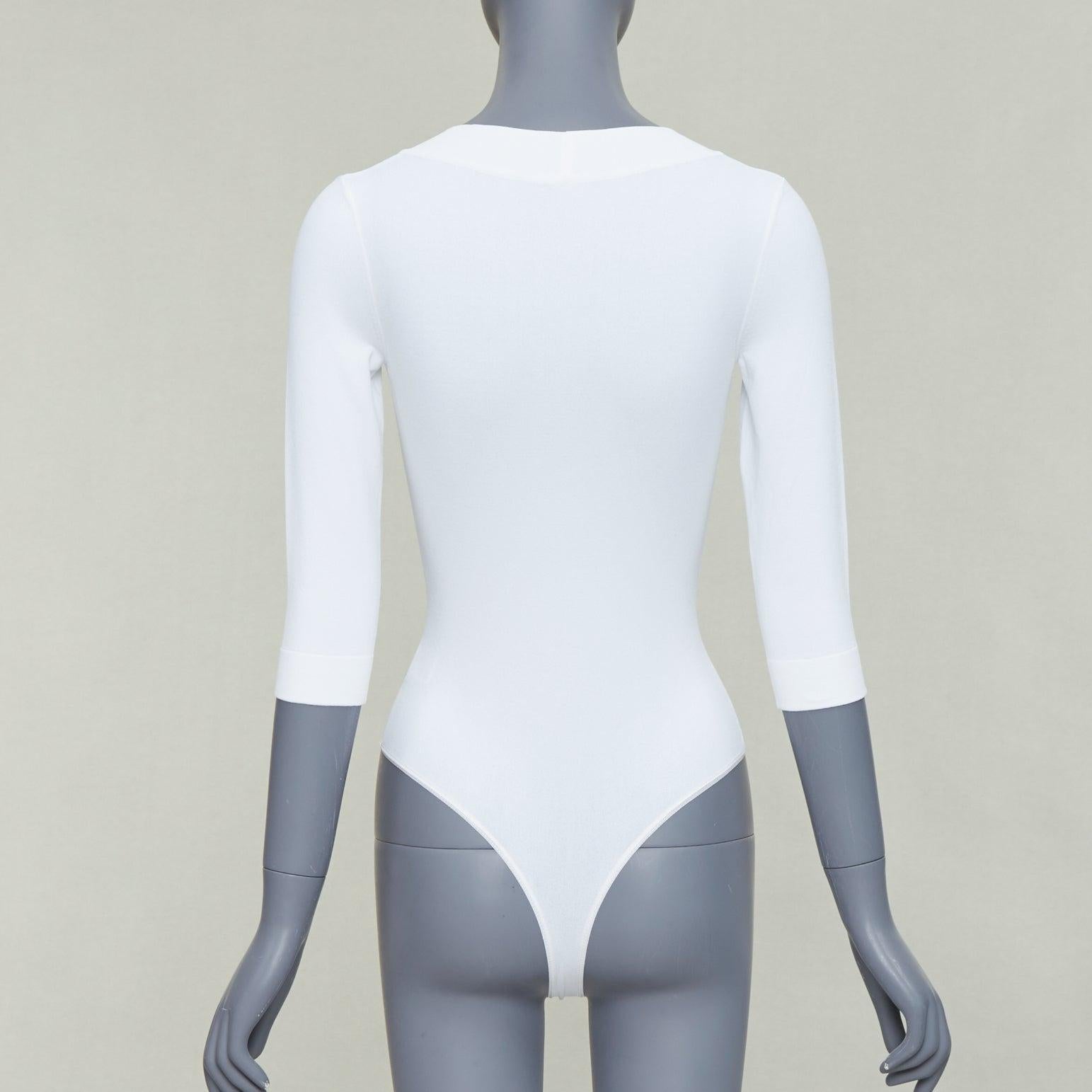 De las mujeres ALAIA top blanco con cuello en pico y mangas 3/4 en mezcla de viscosa FR36 S en venta