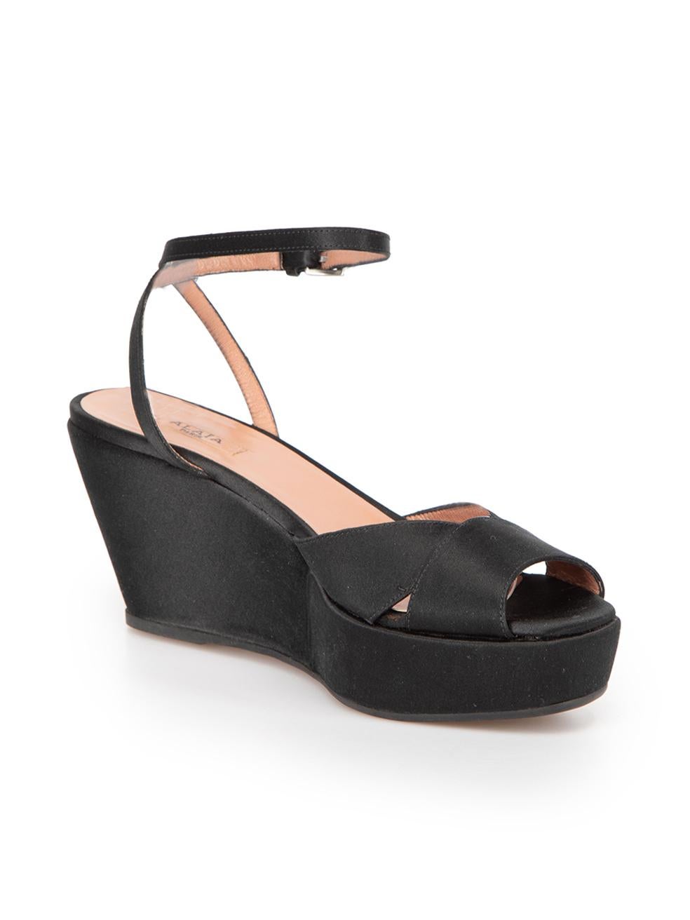 CONDITION is Very good. Minimal wear to shoes is evident. Minimal wear to left and right sides of left shoe with discolouration on this used Alaïa designer resale item. 



Details


Black

Satin

Sandals

Peep square toe

Wedge platform