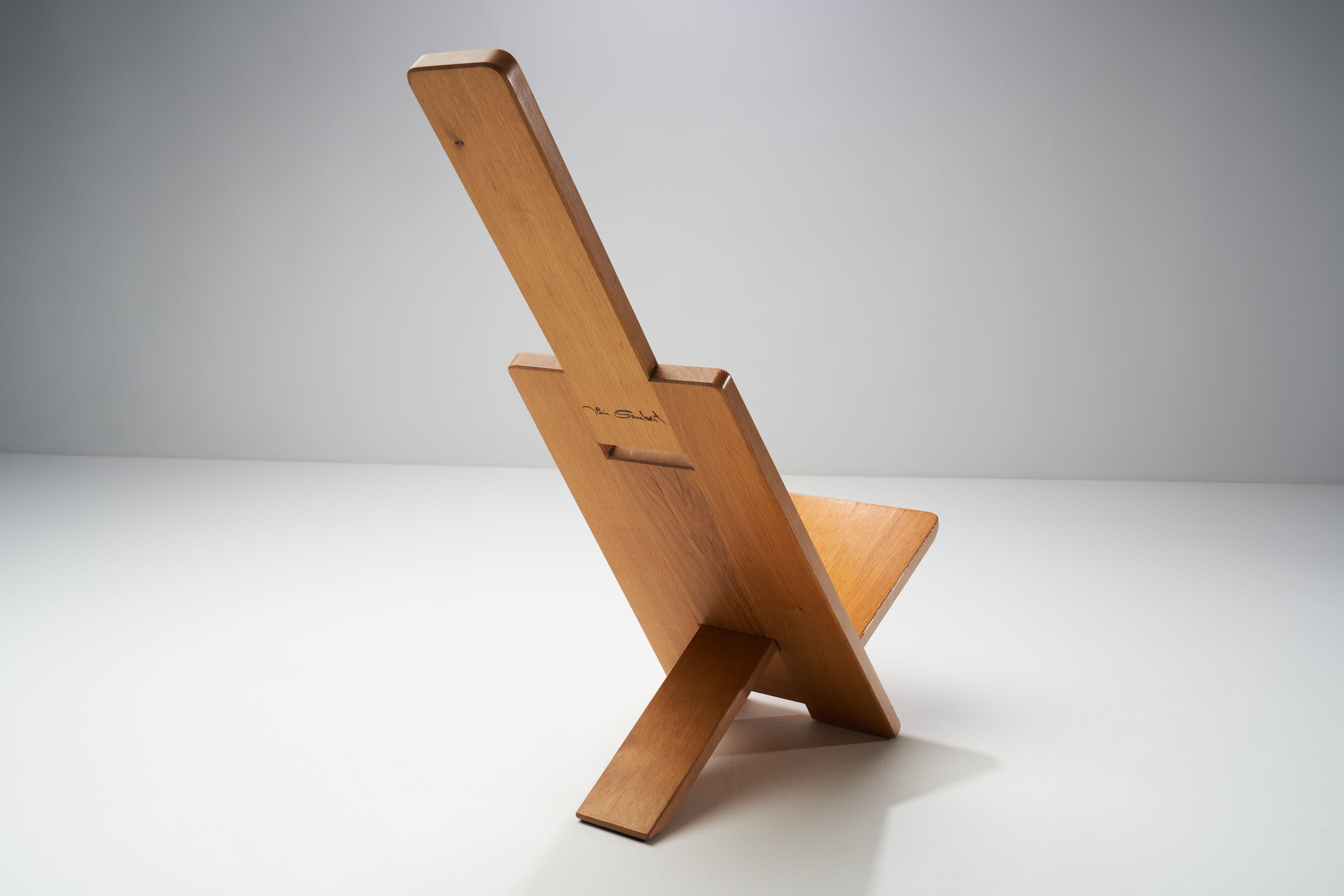 This chair by French designer, Alain Gaubert is an eye-catching nod to Minimalist design. The construction is as ingeniously simple as it is visually striking.

The chair is made of solid oak, and was crafted using just two planes that intersect at