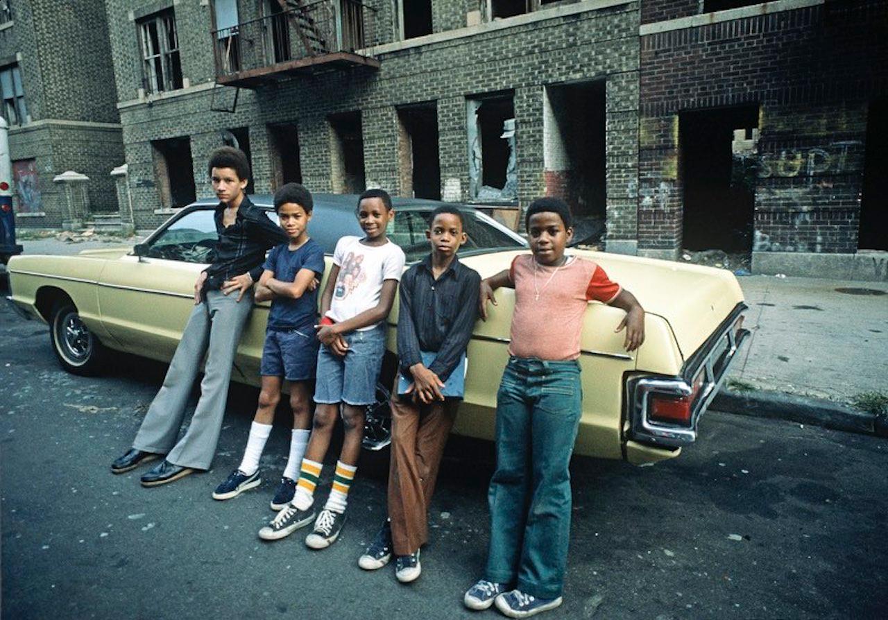 Bronx Teenagers by Alain Le Garsmeur
Teenagers in front of abandoned tenement burnt-out buildings, South Bronx, New York City, USA - August 1977

Paper size 20 x 24 inches / 50 x 61 cm 
Printed in 2024 
Archival Pigment Print 
edition of 15 only