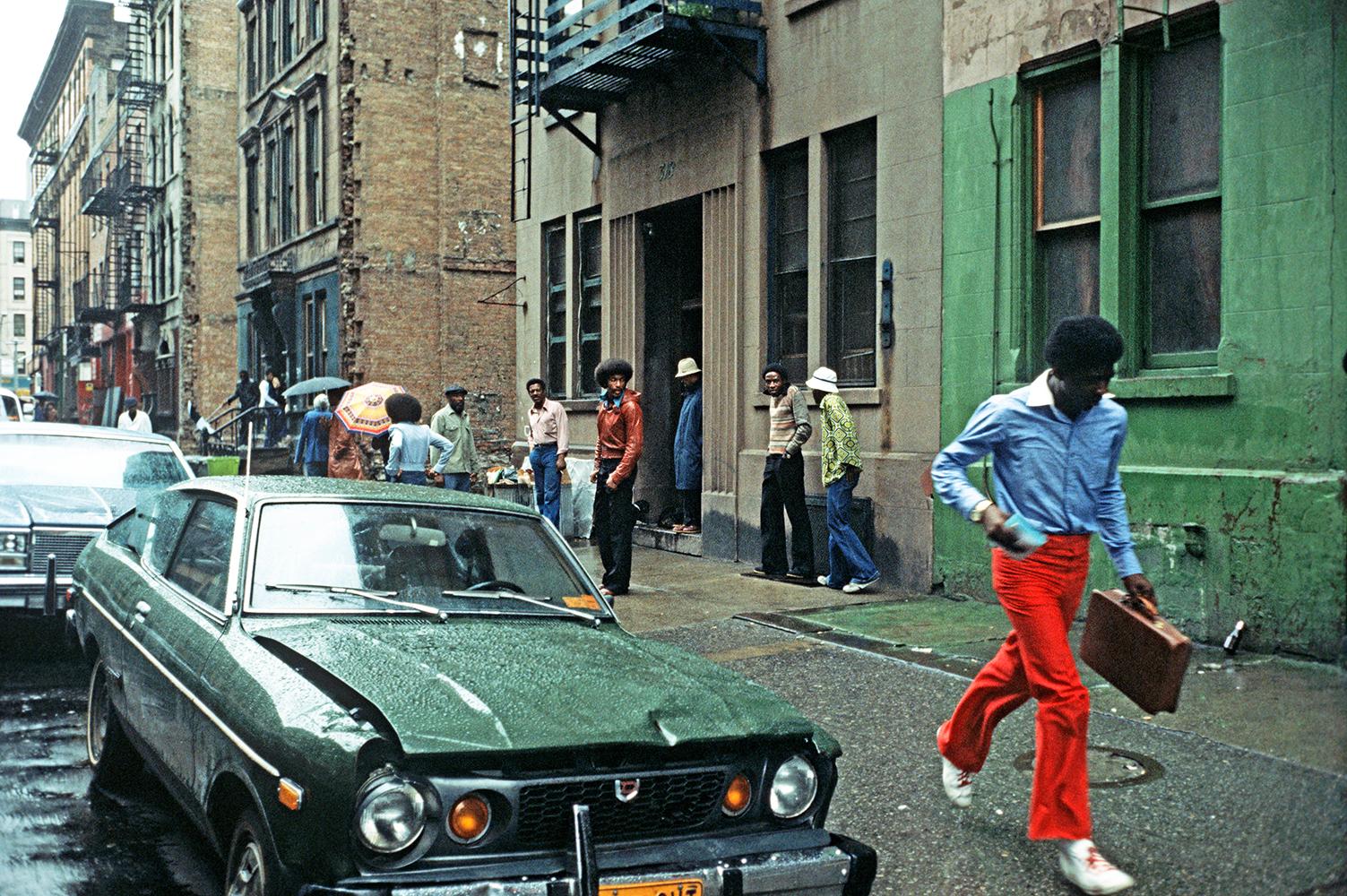 Harlem Rain by Alain Le Garsmeur
A rainy day on the streets of Harlem, New York City, USA, April 1978. 

Paper size 30 x 40 inches / 76 x 101 cm  
Printed in 2022 
Archival Pigment Print 
signed limited edition 
signature and numbering on front