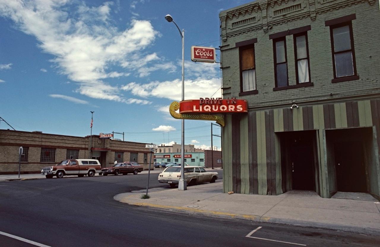 Liquor Store by Alain Le Garsmeur
Exterior of a drive-in liquor store in downtown Cheyenne, Wyoming, USA, 1979.

Paper size 20 x 24 inches / 50 x 60 cm
Printed in 2022 - produced from the original transparency
Archival Pigment Print and limited