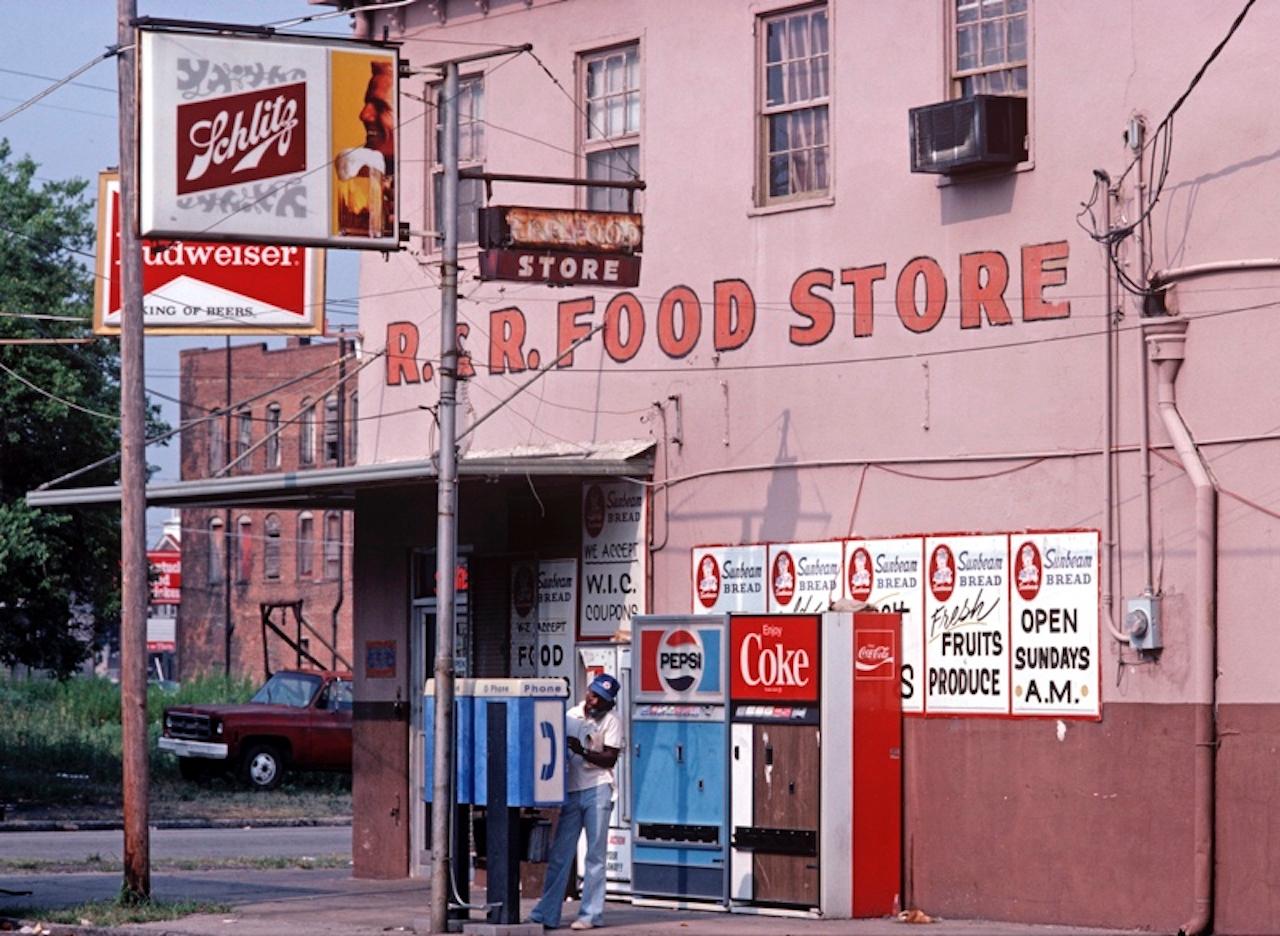 Savannah Food Store by Alain Le Garsmeur
A food store on the corner in downtown Savannah, Georgia, USA, 1983. 

Paper size 16 x 20 inches / 40 x 50 cm 
Printed in 2022 - produced from the original transparency
Archival Pigment Print and limited