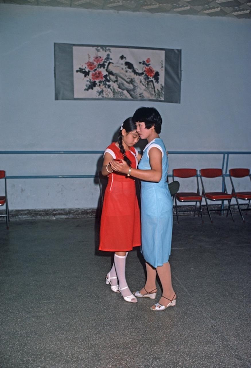 Take Two by Alain Le Garsmeur
Two dancers in a bomb shelter used as a nightclub, Harbin, Heilongjiang Province, China, 1985. 

Paper size 24 x 20 inches / 60 x 50 cm
Printed in 2022 - produced from the original transparency
Archival Pigment Print