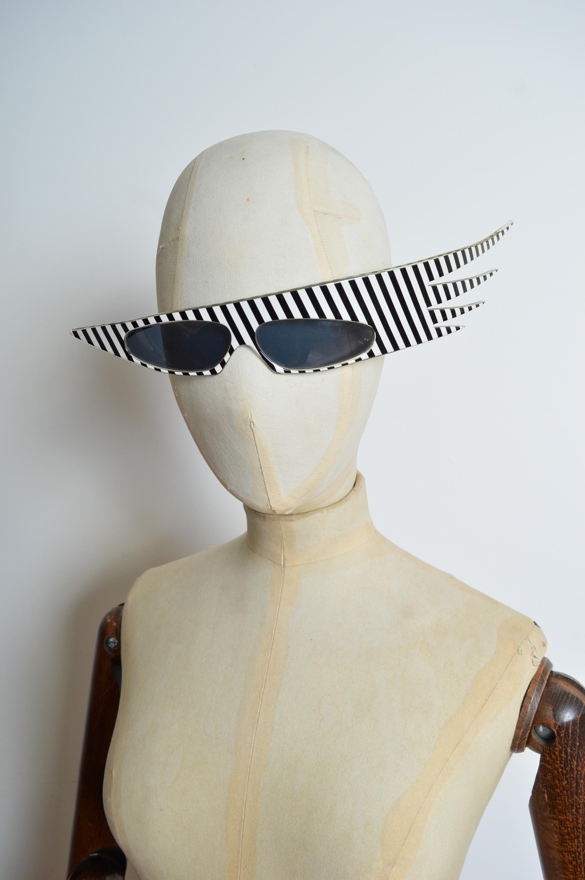 Alain Mikli Rare 1980's Plume Striped Avant Guard Crazy Sunglasses produced by 'Shoptique' Model number : 054104. 
Size - One size / Standard.
Measurements in inches:
Frame length across the Front - 12.5”
Frame hight - 1.75” 
Condition; 8/10