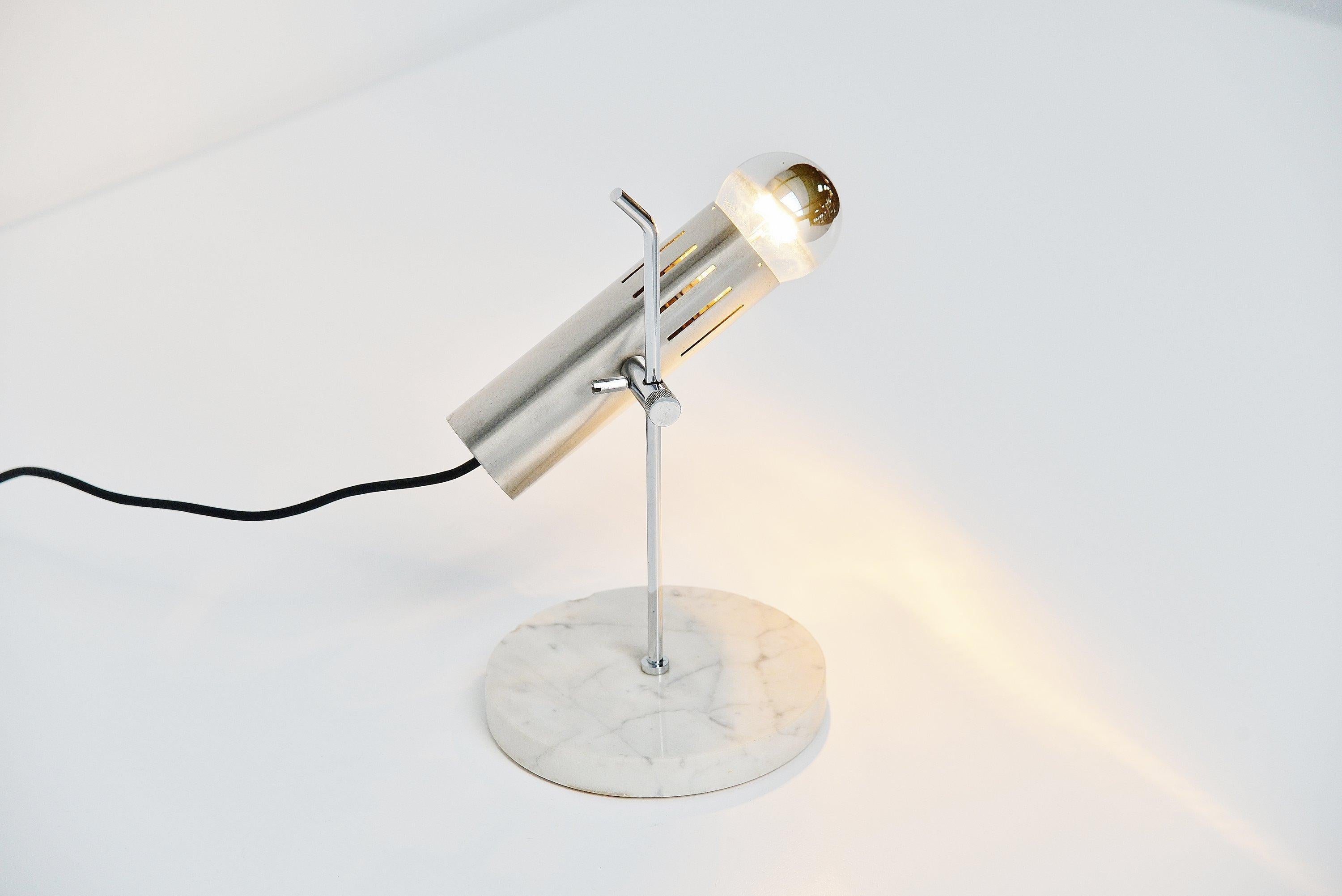 Minimalist table lamp model A4 designed by Alain Richard and manufactured by Disderot, France 1958. This lamp has a solid white Carrara marble base and a chrome peg that holds the tubular aluminium shade. Looks great with a half mirrored bulb and