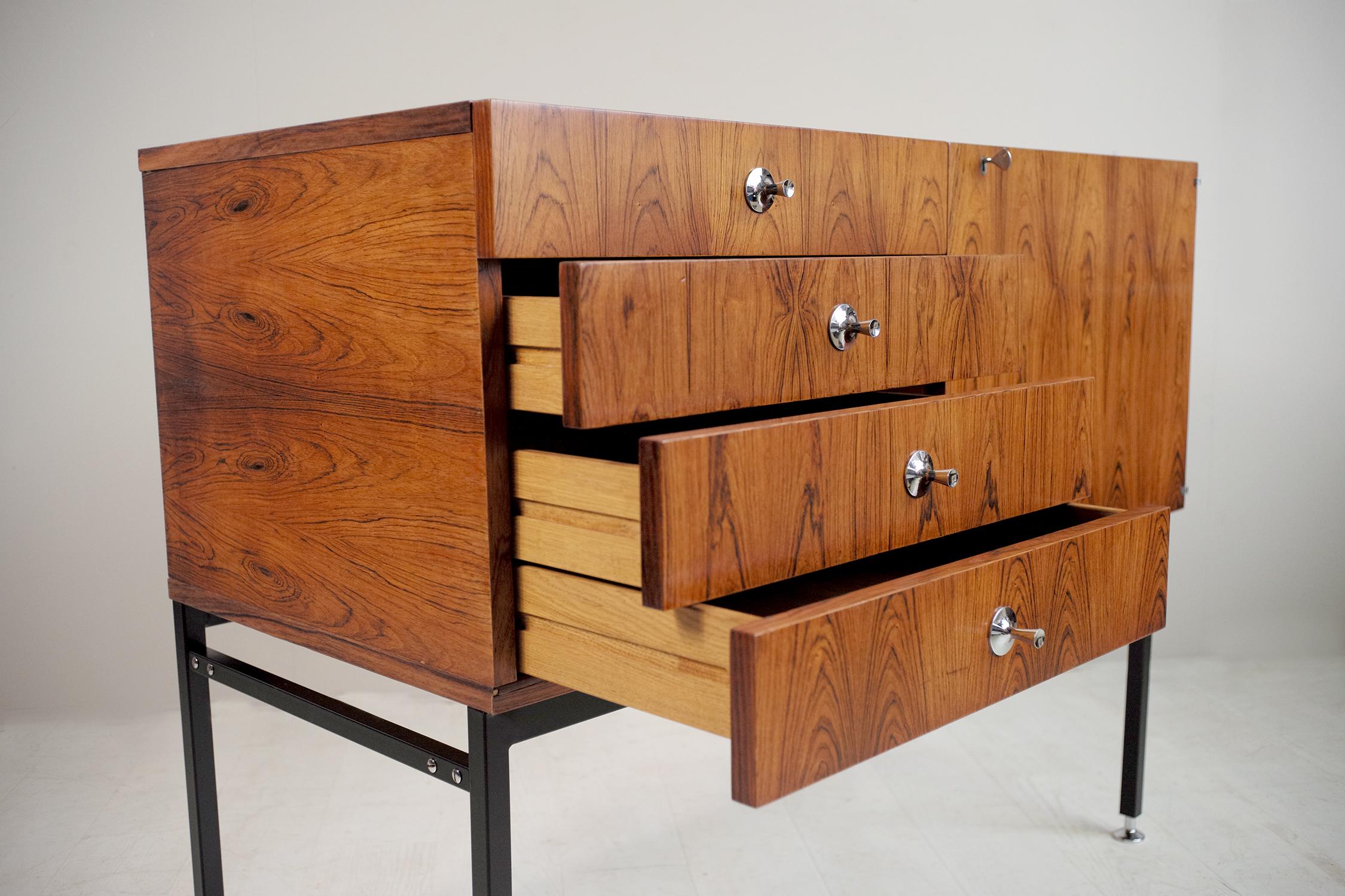 Alain Richard, rosewood sideboard series 800 edited by Meubles TV, France, 1959. Black lacquered steel base, mounted on adjustable chromed metal glides, a door and four drawers. This beautiful piece is signed Alain Richard and TV furniture inside