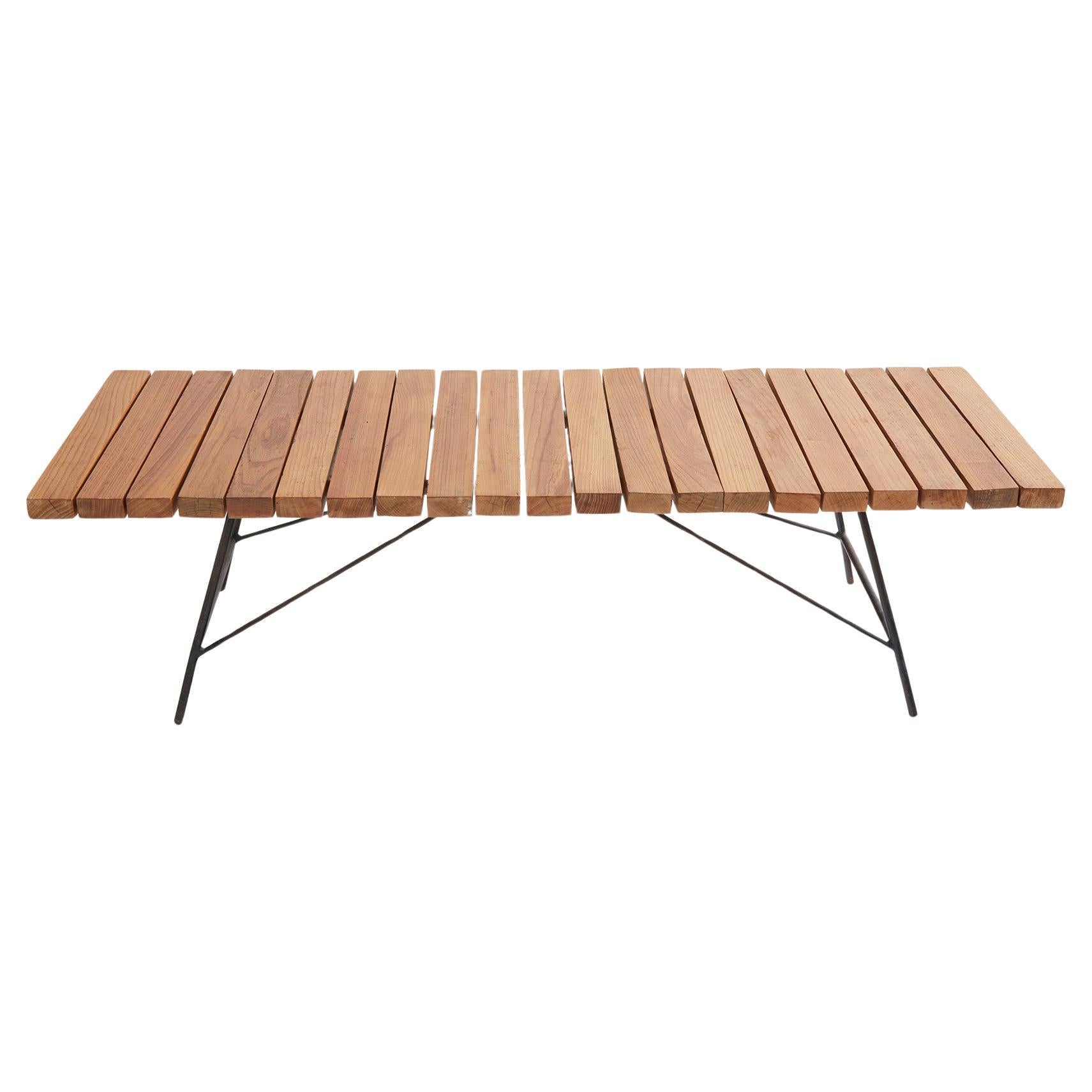 Alain Richard Bench-Coffee table, Model 201, Ed. Meubles T.V., France, circa 1954.

This beautiful and rare mid-century bench or coffee table exemplifies the elegance of Alain Richard’s designs, featuring varnished natural ash slats and a black iron