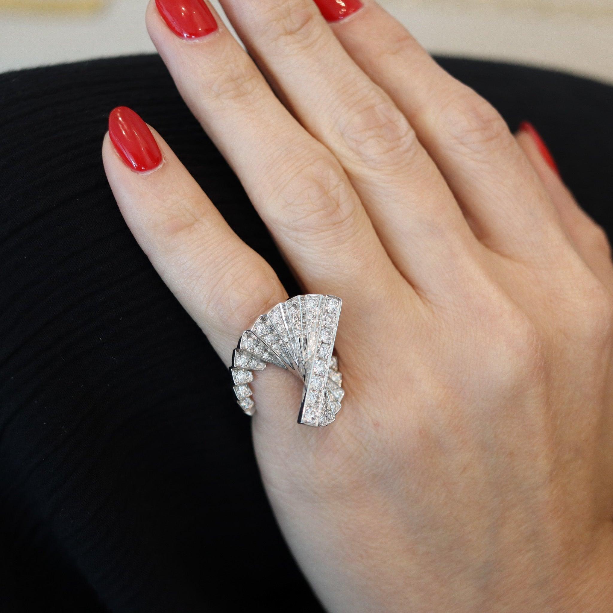 Sculptural geometric ring designed by Alain Roure.

This is a fabulous sculptural ring, created in France by Alain Roure, back in the 1970. The amazing ring has been designed with an unusual escalator, geometric patterns in solid white gold of 18