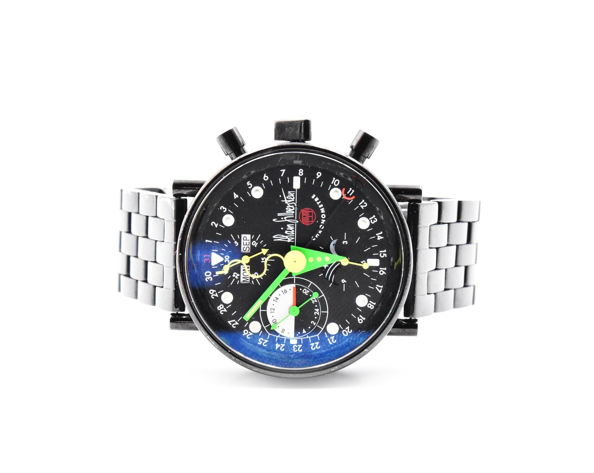 Movement: automatic
Function: hours, minutes, day-date-month, moon phase
Case: 40mm round black stainless steel
Dial: black with three sub dials are at 12, 6 and 9 o'clock for the chrono feature also the watch has day-date feature and the moon