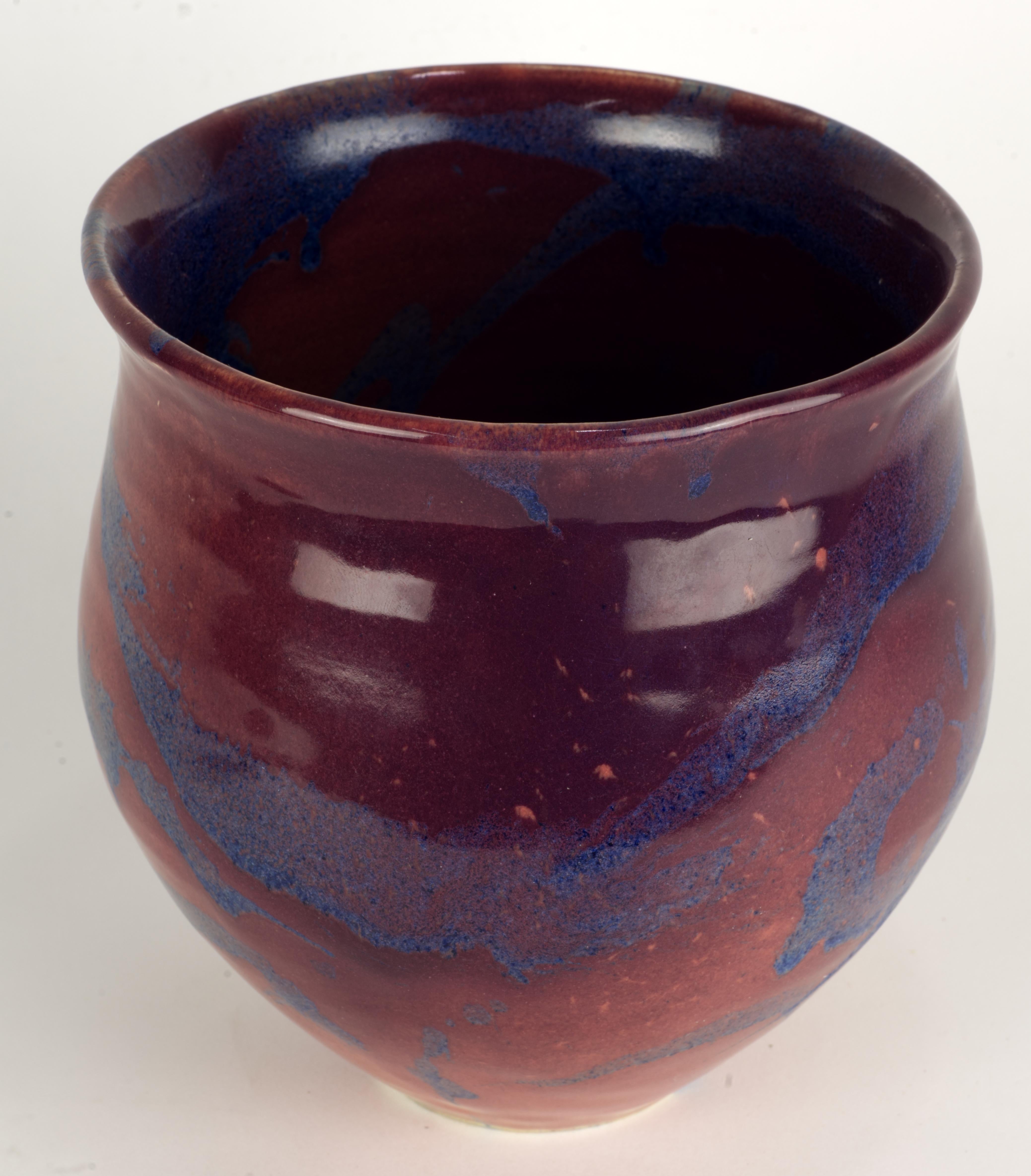  Rare large vase was hand thrown by Alan Brough. The vase was hand decorated in an unusual ombre dark purple and mottled blue palette, with soft, fluid background color changes and abstract asymmetrical blue glaze patterns complementing the minimal