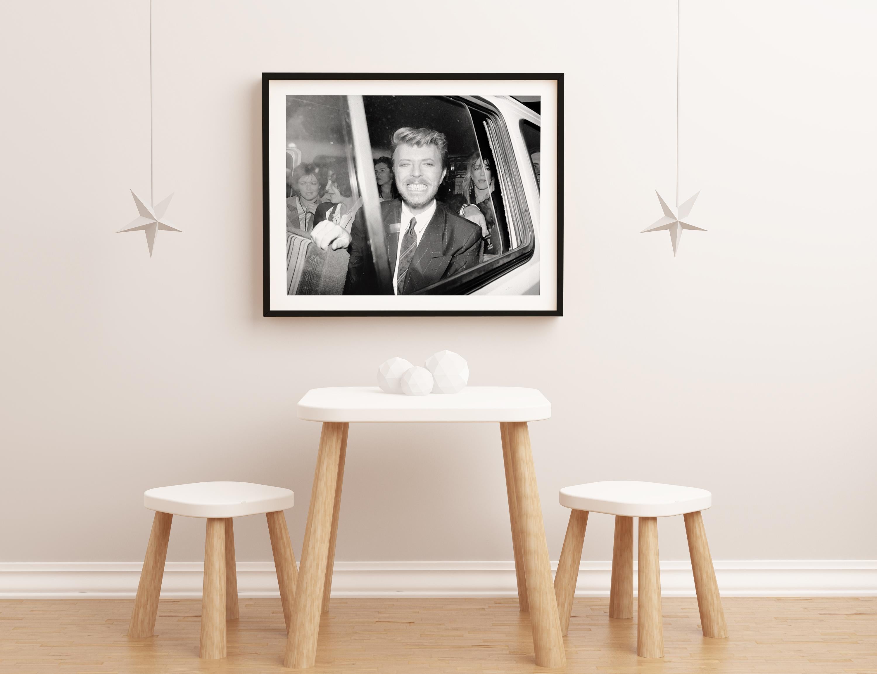 David Bowie: Big Smile in Car Window Globe Photos Fine Art Print - Black Portrait Photograph by Alan Davidson