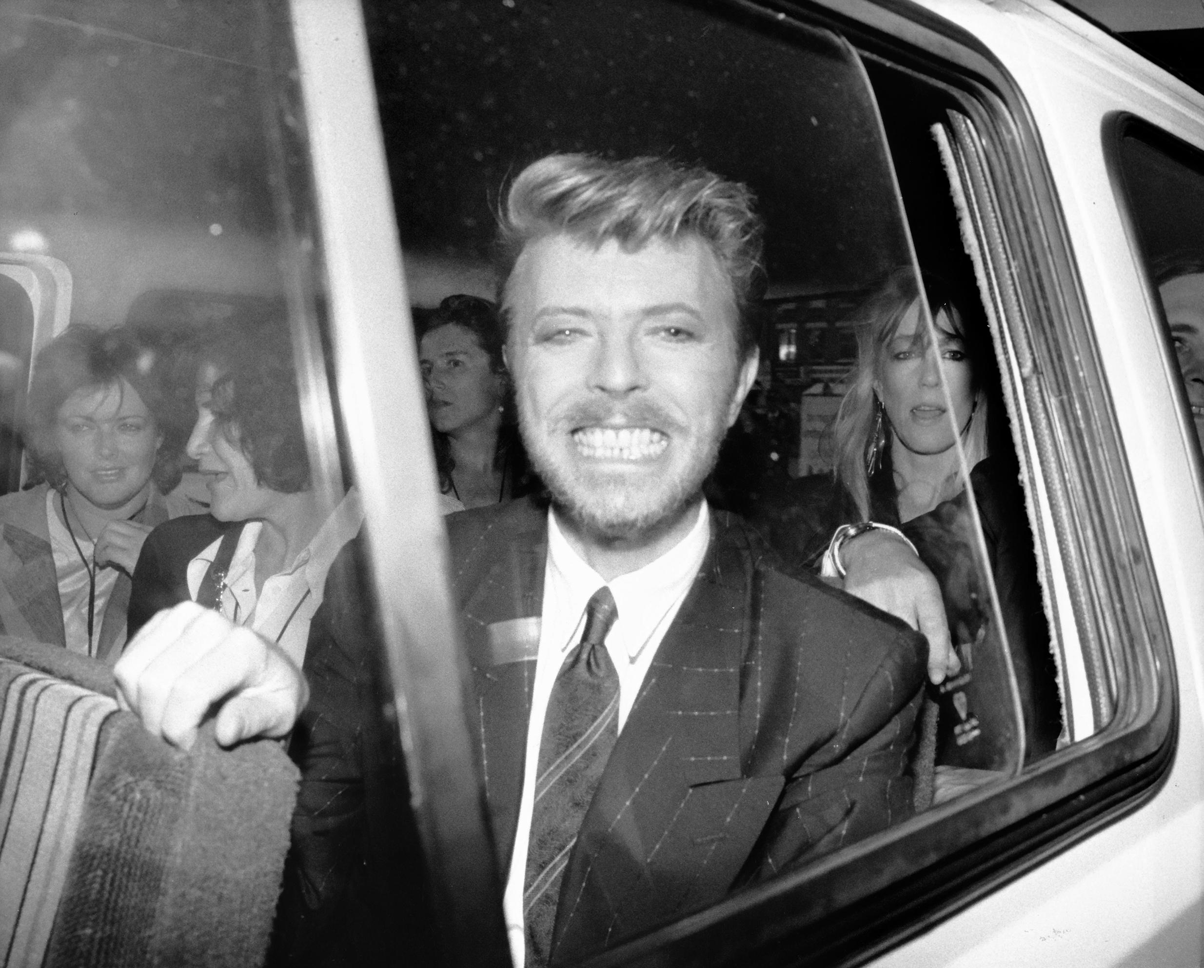 Alan Davidson Portrait Photograph - David Bowie: Big Smile in Car Window Globe Photos Fine Art Print
