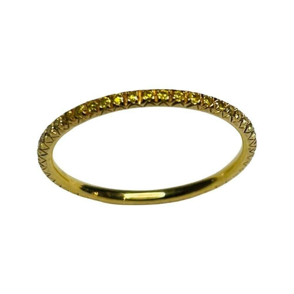 Alan Friedman 18K Yellow Gold Fancy Intense Yellow Diamond Eternity Band. This ring is 1.4 mm in width. The 47 diamonds have a total diamond weight of 0.34 carats. The diamonds are natural color, fancy intense yellow.  The diamonds are micro pave