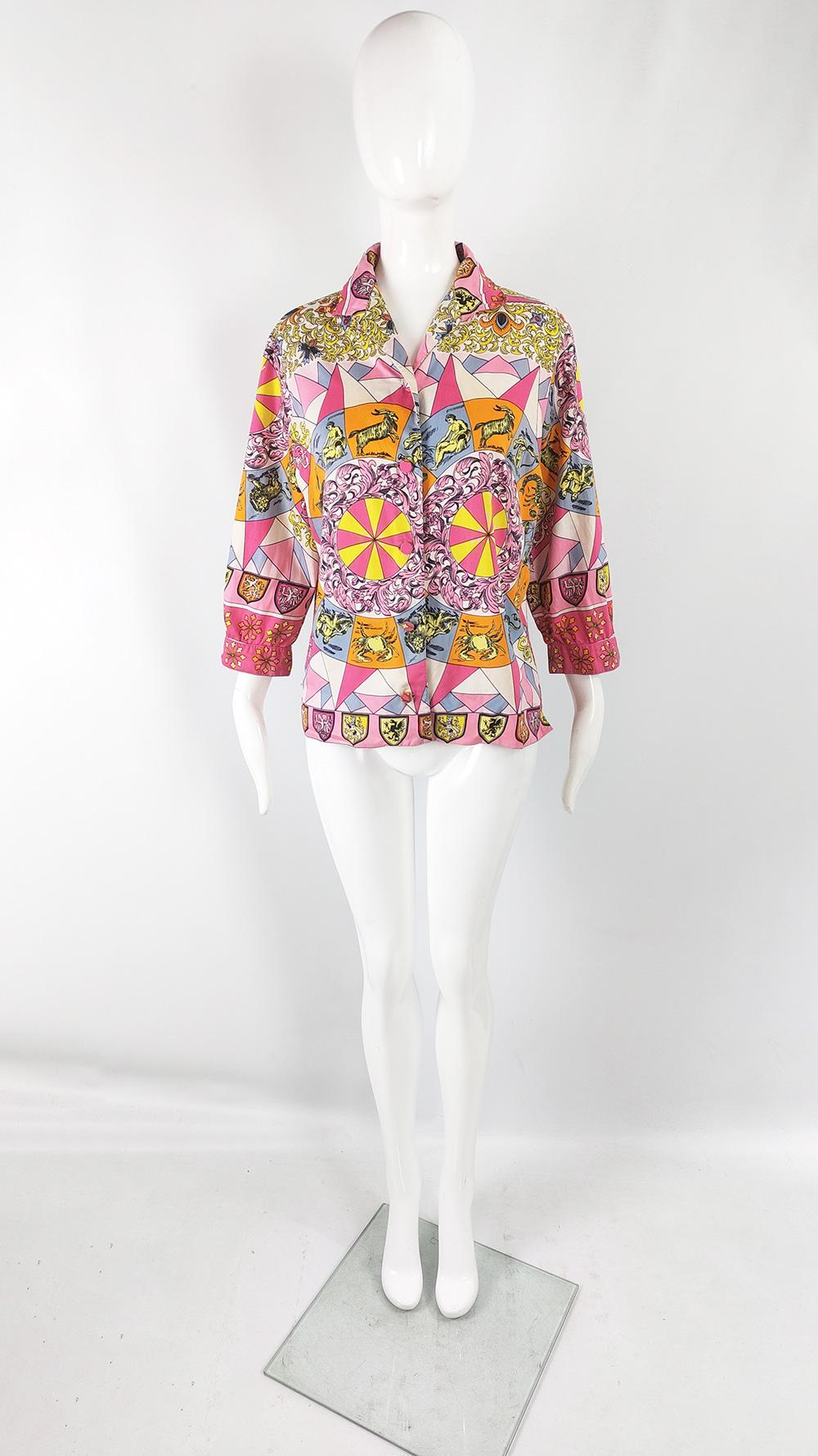 A stunning vintage womens blouse from the 60s by quality British label, Alan Lee. Made from a boldly patterned rayon fabric with a horoscope print throughout.

Size: Unlabelled; measures roughly like a modern womens Medium to Large, meant to have a