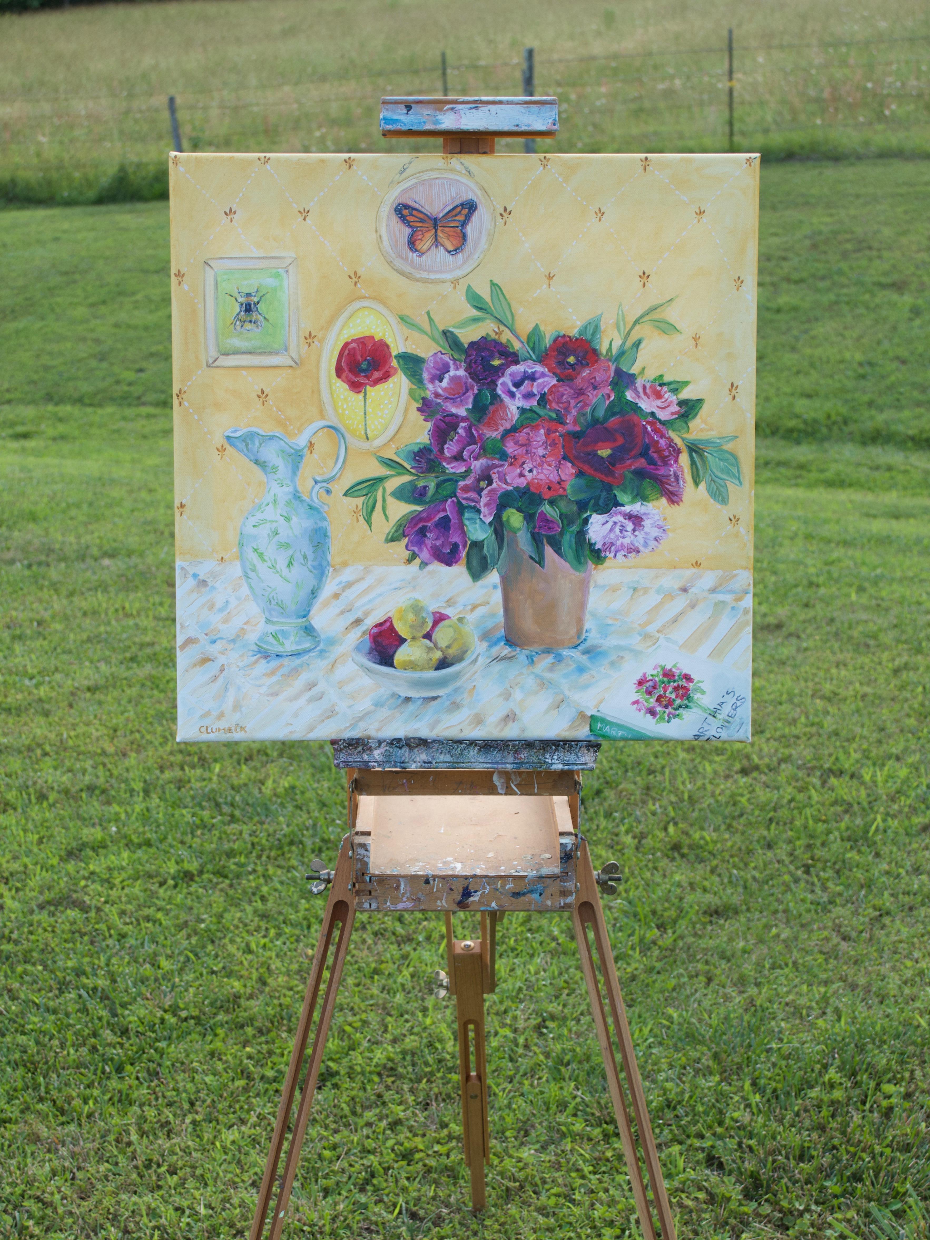 <p>Artist Comments<br>A flower arrangement and a white pitcher rest on a table. A bowl of fruits rests between them while a book peeks from the corner. Behind the arrangement, a warm yellow wall displays framed images of a butterfly, a bee, and a