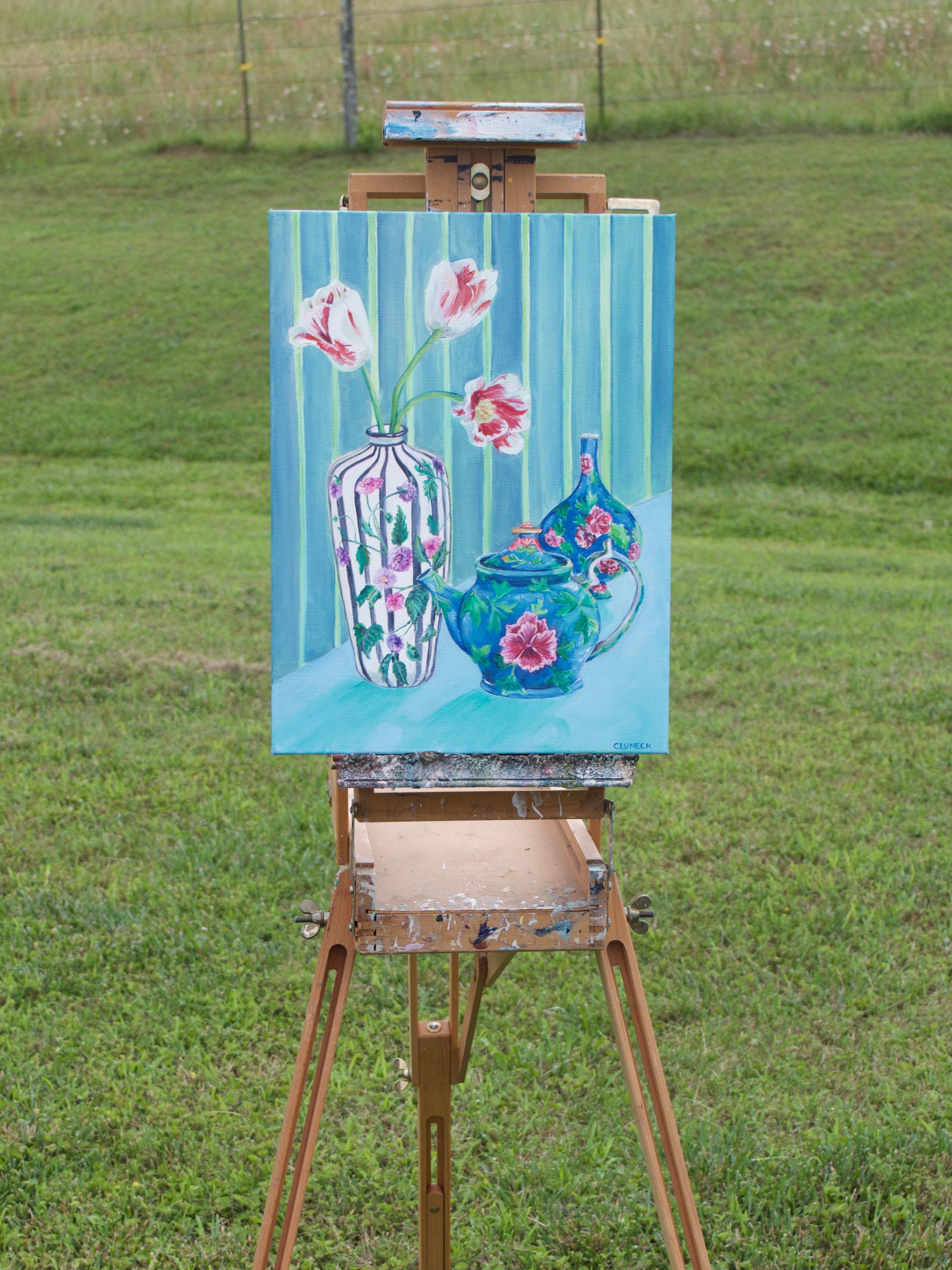 <p>Artist Comments<br>Dainty tulips bloom from a tall vase with their petals gently curling outward. A teacup and a bulbous vase sit nearby. Floral motifs adorn all the containers, while green and blue stripes decorate the wall behind. Through the