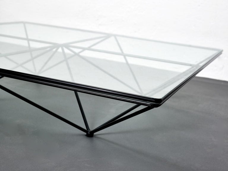 Alanda coffee table by Paolo Piva with square glass and metal structure

This beautiful and minimalist coffee table is composed by a glass top with rounded edges sitting on an almost optical design metal structure.

This is a great example of