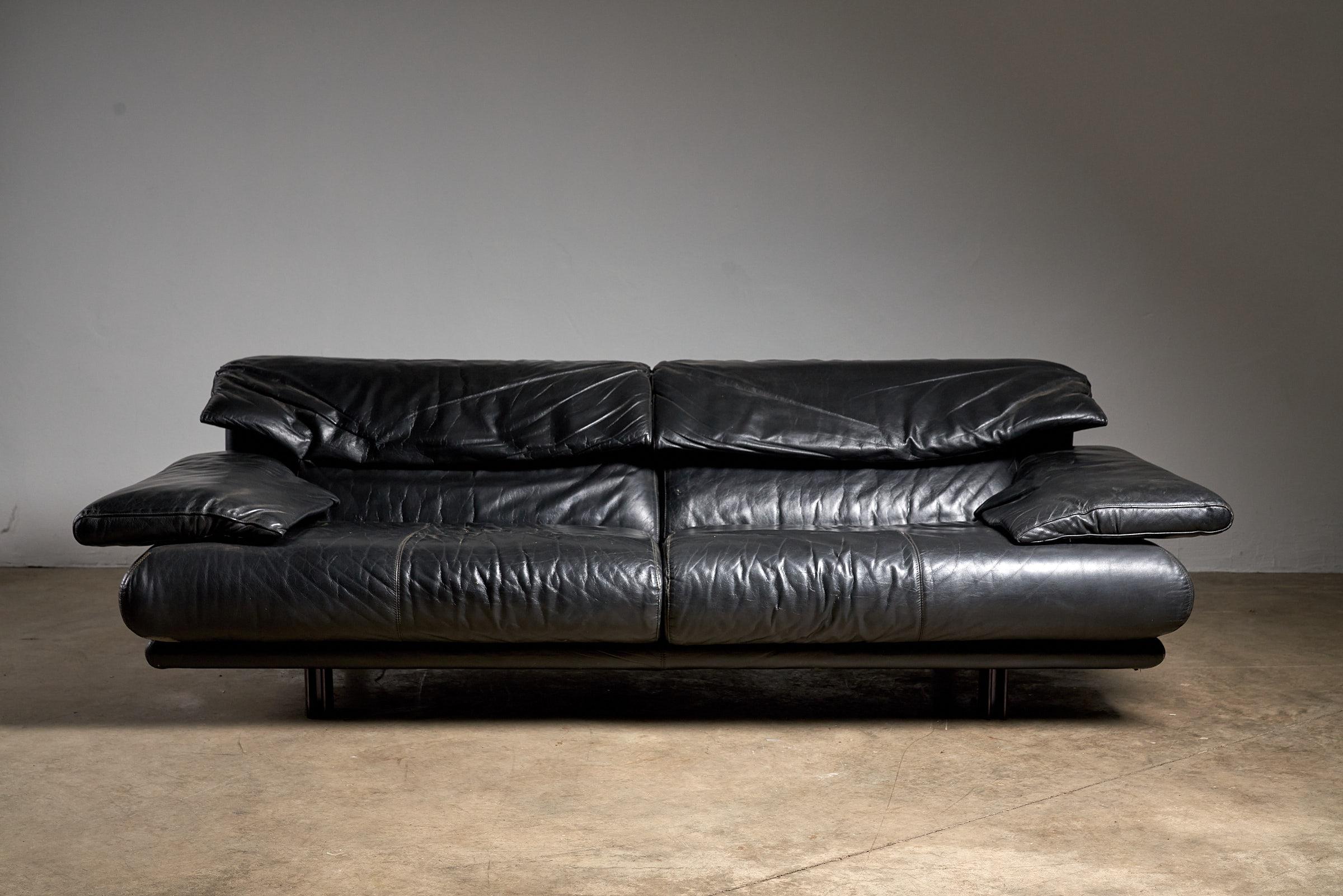 Immerse yourself in luxury with the Alanda sofa, designed by Paolo Piva for B&B Italia. This exquisite piece showcases timeless elegance in black leather. The geometric design and leather upholstery make it a statement piece, perfect for both