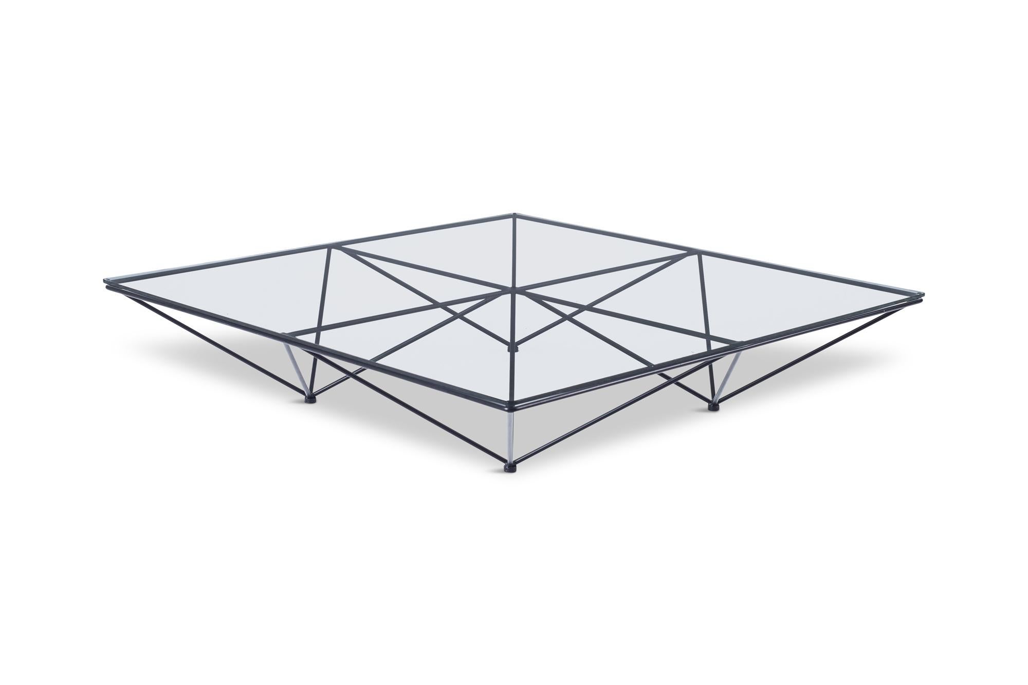 Paolo Piva original Alanda coffee table, an iconic piece that ushered in the 1980s, for B&B Italia .The Alanda’s structure, serving as both pedestal and support, recalls a group of upturned pyramids, a geodetic frame that has always characterized it