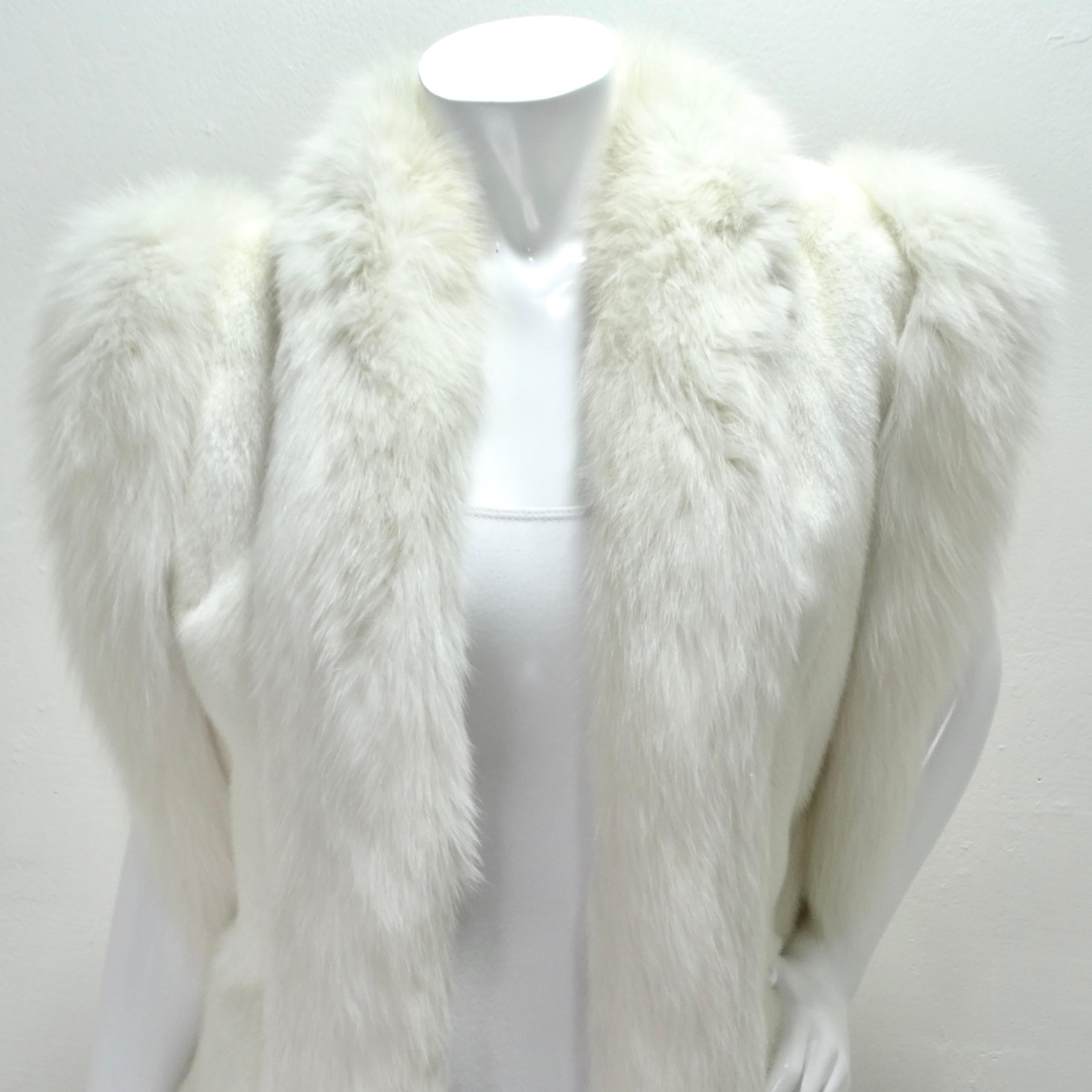 Step into the lap of luxury with our 1980s Alaskan Fur Gallery white mink fur vest! Indulge in the softness and opulence of genuine fur, making you feel like royalty. Its perfect classic length ensures a timeless look that will never go out of