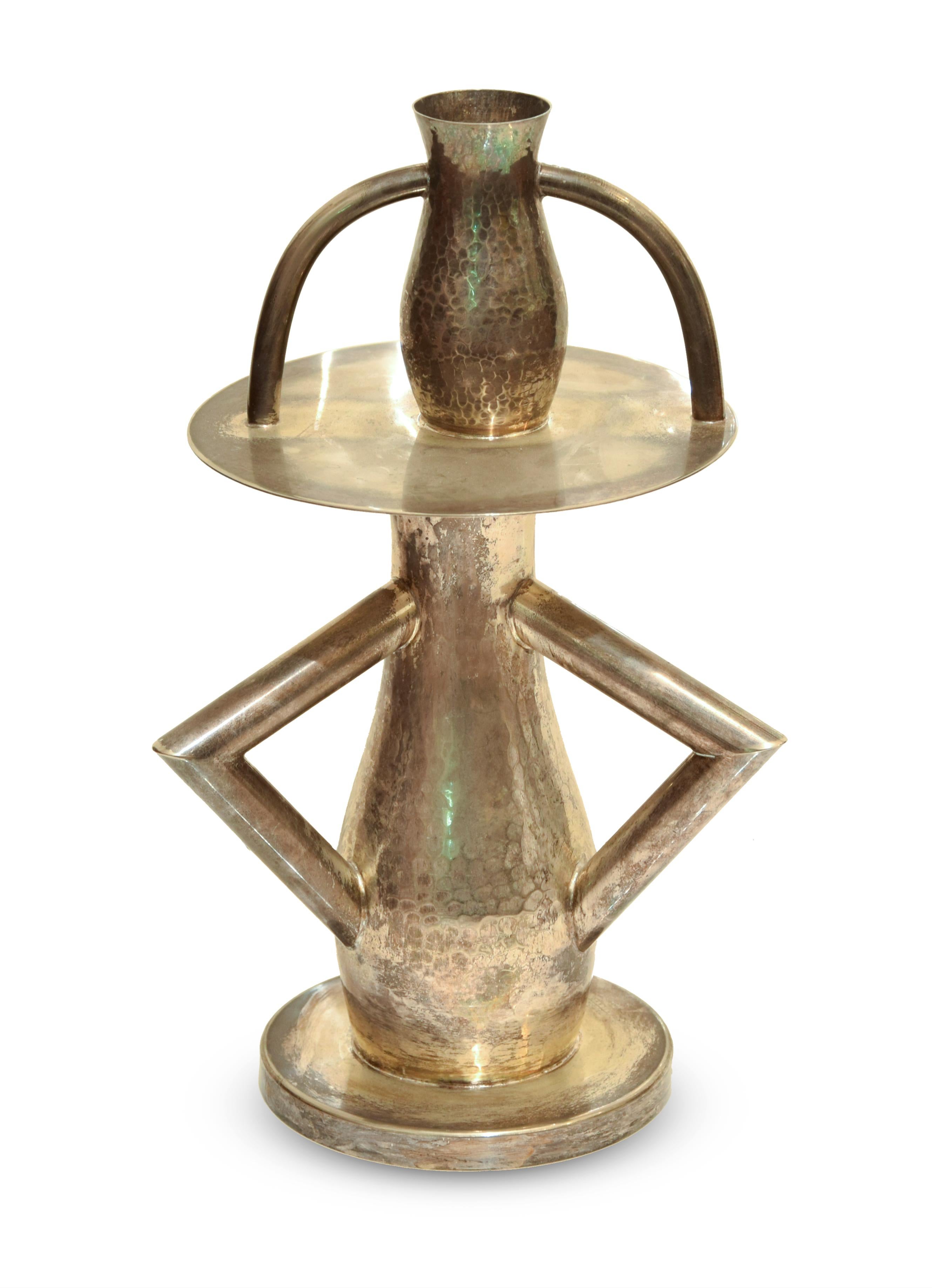 Alaska is an original decorative silver object realized and created by Ettore Sottsass in the 1980s. 

Original silver candlestick realized in 1981. 

Made in Italy.

The label of authenticity is impressed on the base of the work.