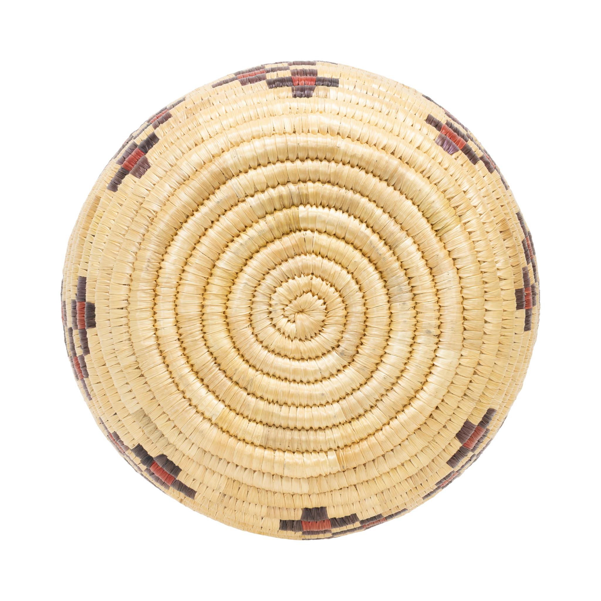 Native American Alaskan lidded basket. Featuring geometric butterfly and checkerboard designs around body in lid done in purple and red. Great piece for display or careful continued use. Mid 20th century. Size: 8