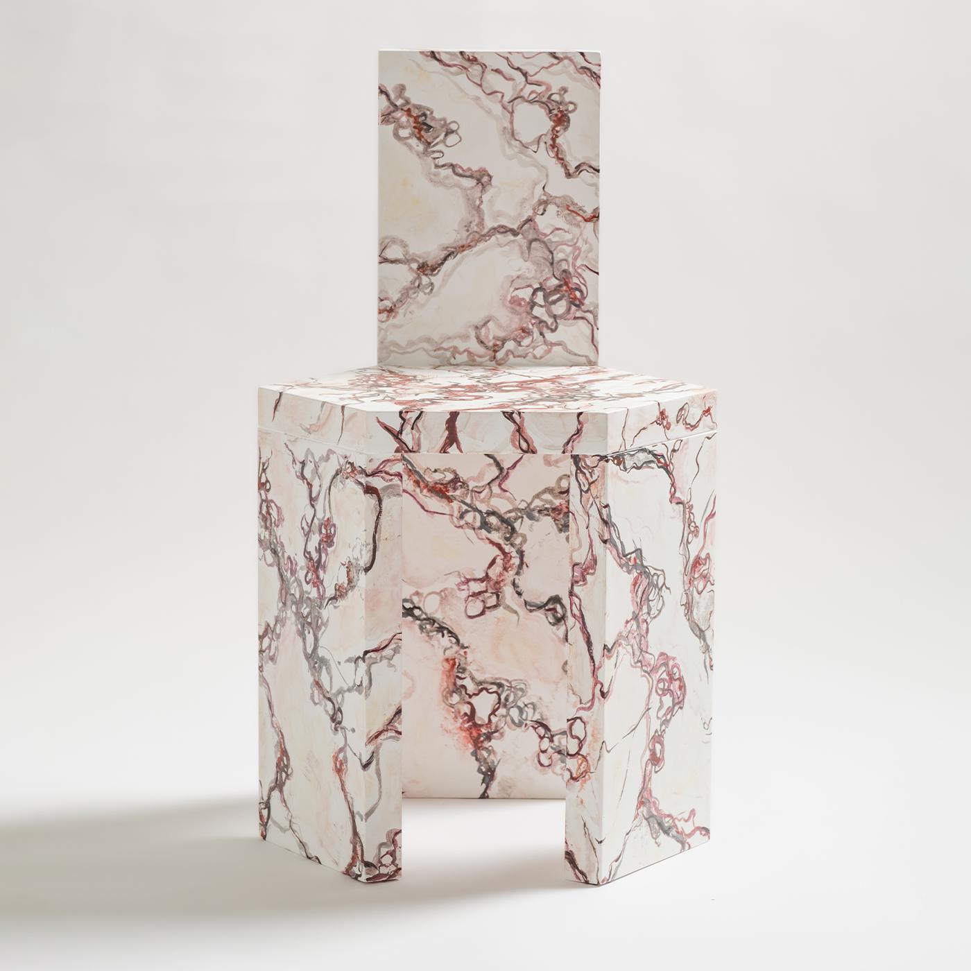 Inspired by prized Italian marbles, this chair is meticulously crafted from the fusion of minimalist design principles and ancient artistic traditions. With 4cm-thick composite elements, this chair is both solid and functional, featuring a wood