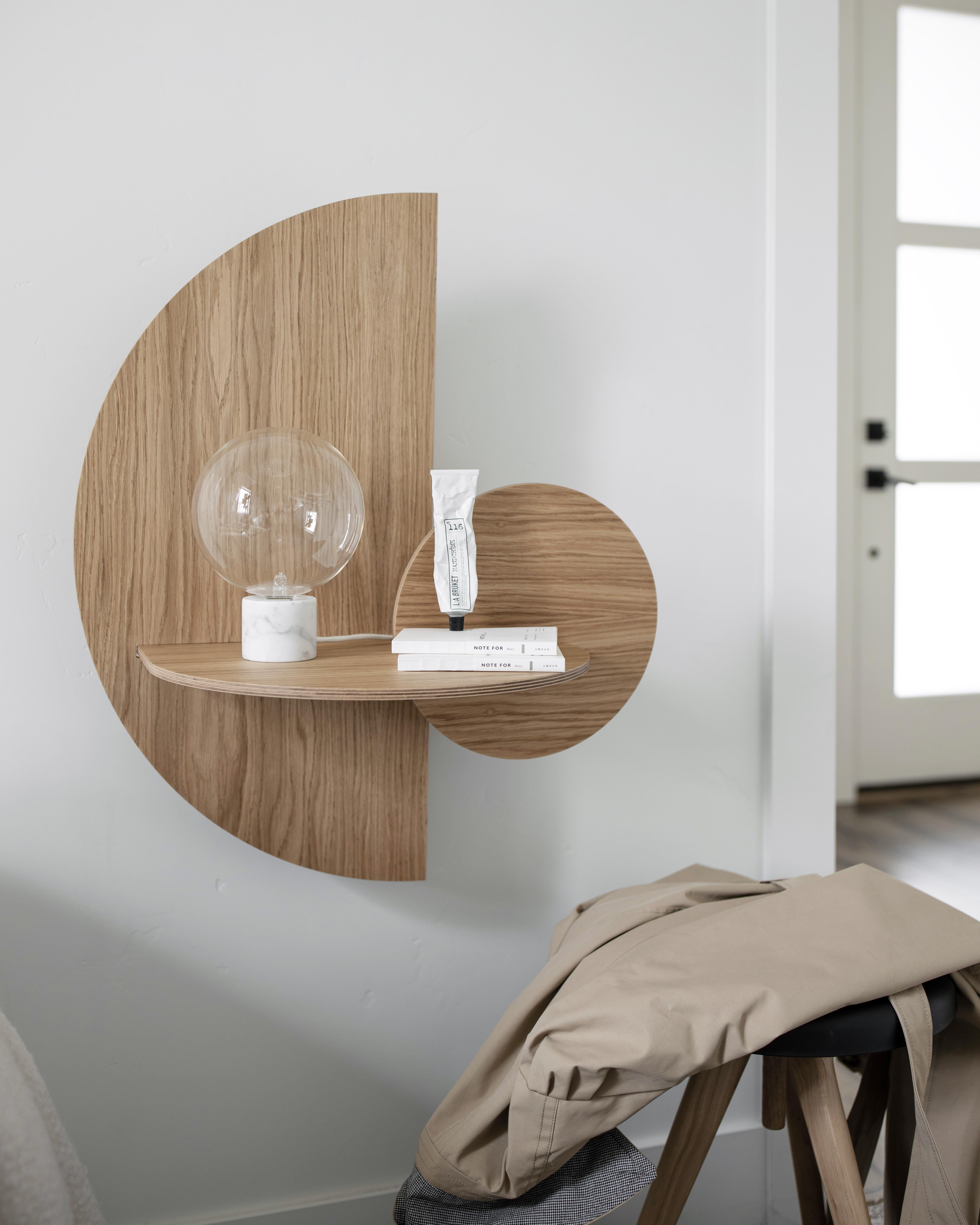 Alba is a versatile product that can be used as a wall shelf with hidden storage and as a bedside table with concealed storage. Alba means “sunrise” in Spanish, hence its name, since the two front pieces of the product simulate the sun and the moon