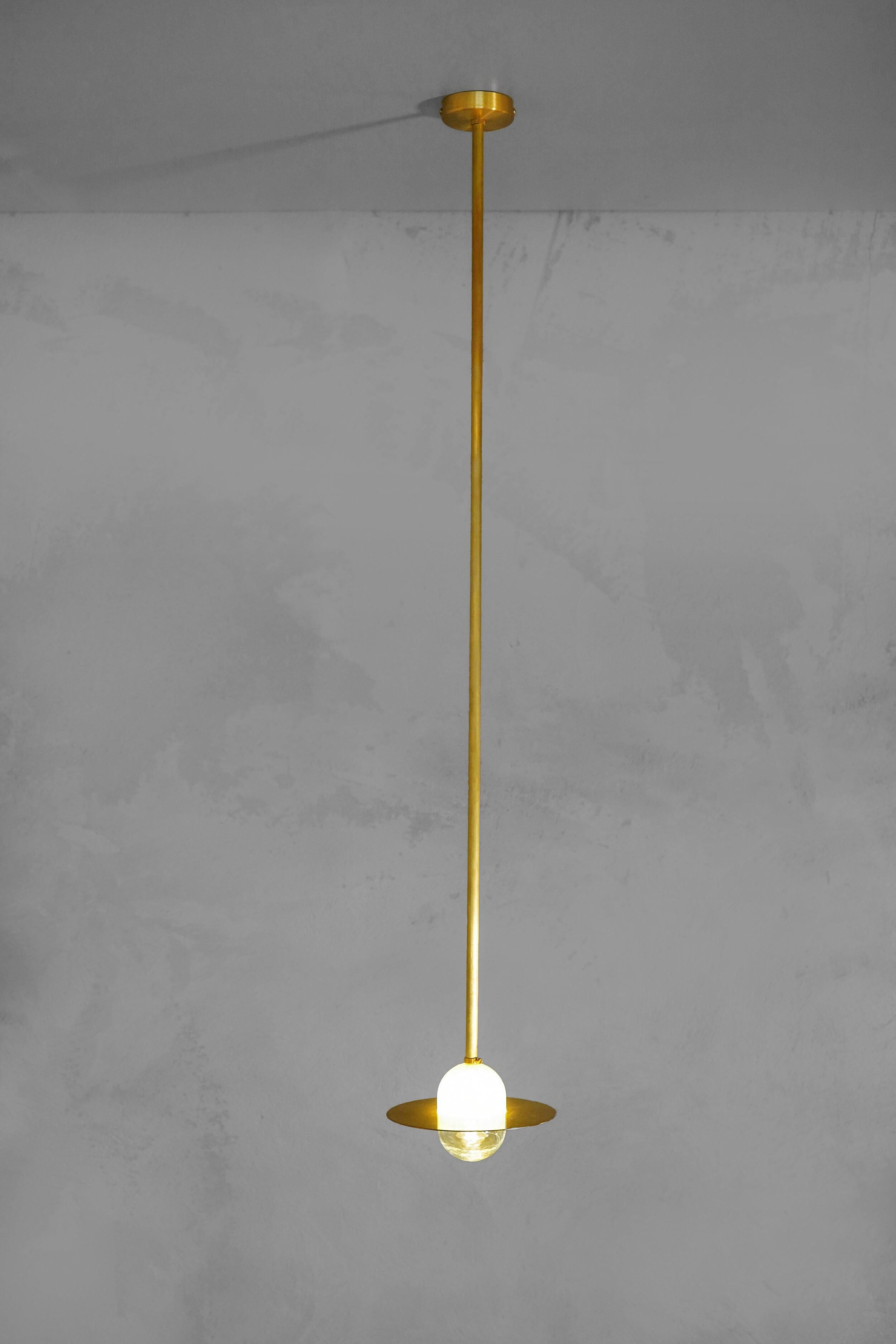 Alba pendant tube by Contain.
Dimensions: D 15 x W 15 H 100 cm (custom length).
Materials: brass, 3D printed PLA structure and optical lens.
Also available in different finishes.

All our lamps can be wired according to each country. If sold to