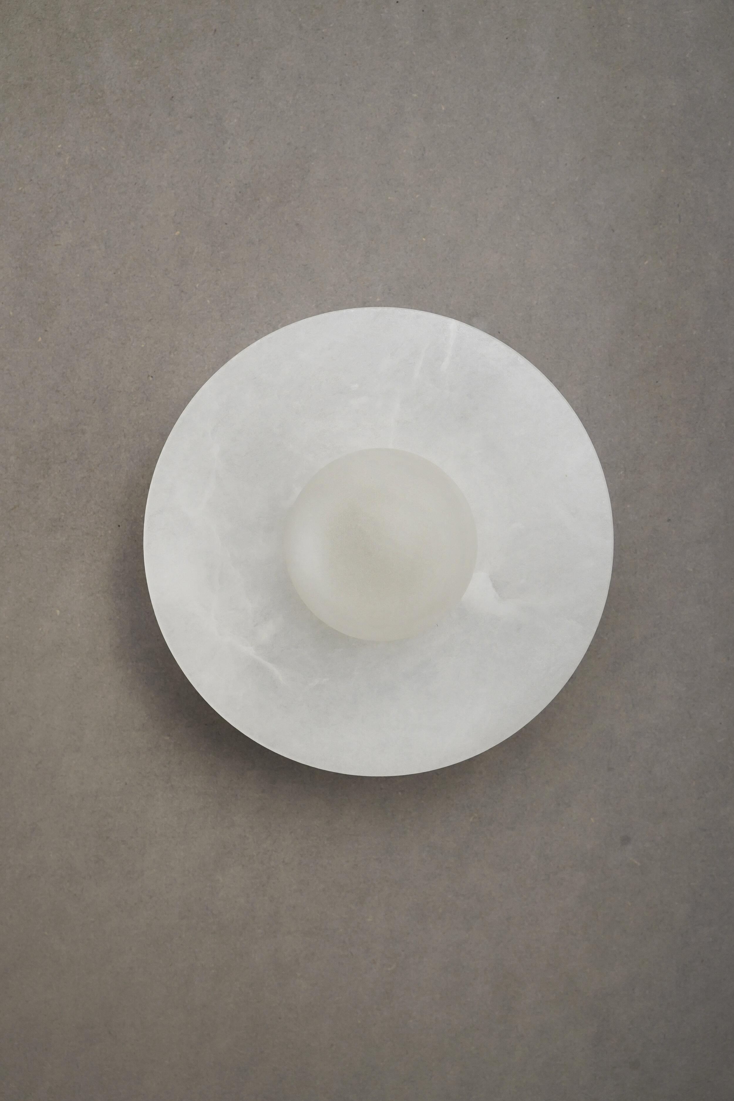 Alba Simple Wall Alabaster Light by Contain
Dimensions: D 15 x H 9.5 cm.
Materials: alabaster structure and optical lens.

All our lamps can be wired according to each country. If sold to the USA it will be wired for the USA for instance.

“You are
