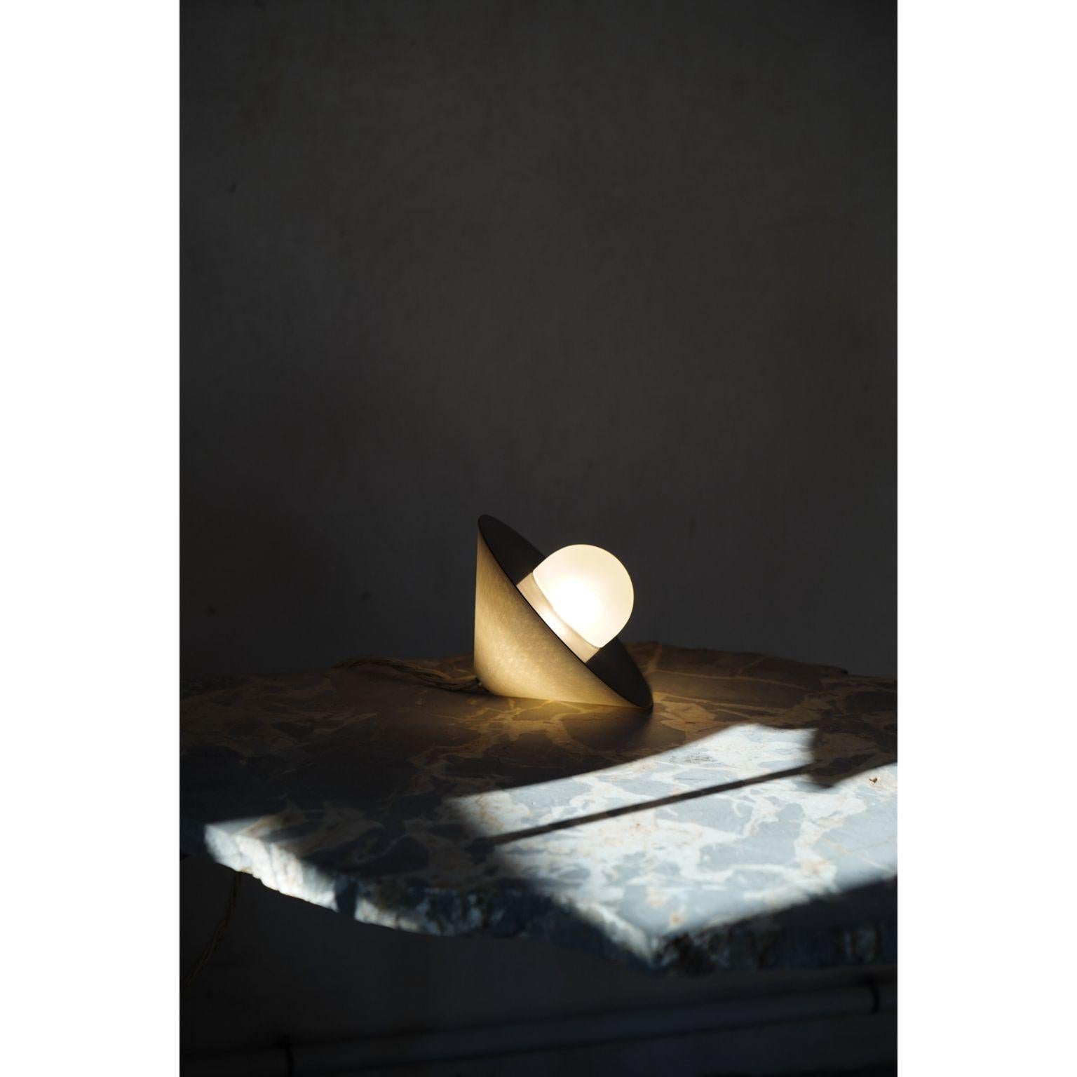 Alba top table lamp by Contain
Dimensions: D15x W15 xH12 cm 
Materials: brass, 3D printed PLA structure and optical lens.
Also available in different finishes and dimensions (22 cm Ø x 15 cm Ø x 12 cm).

All our lamps can be wired according to