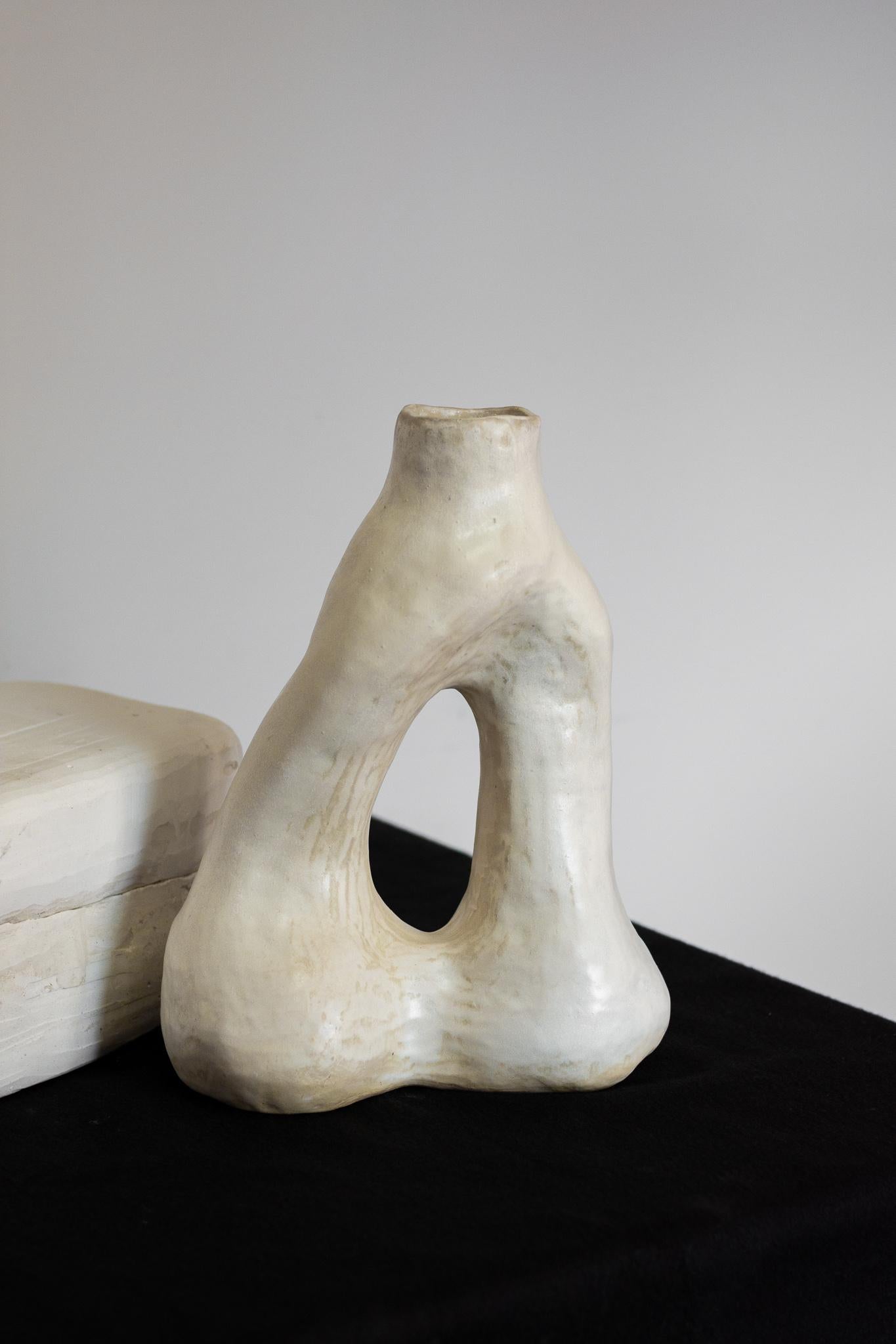 The vase from the Alba series, especially the N.5 vase, is a unique piece that embraces the artisanal process. Manufactured without the use of molds, each vase absorbs the distinct contours and textures of the artist's hand, resulting in a clean and