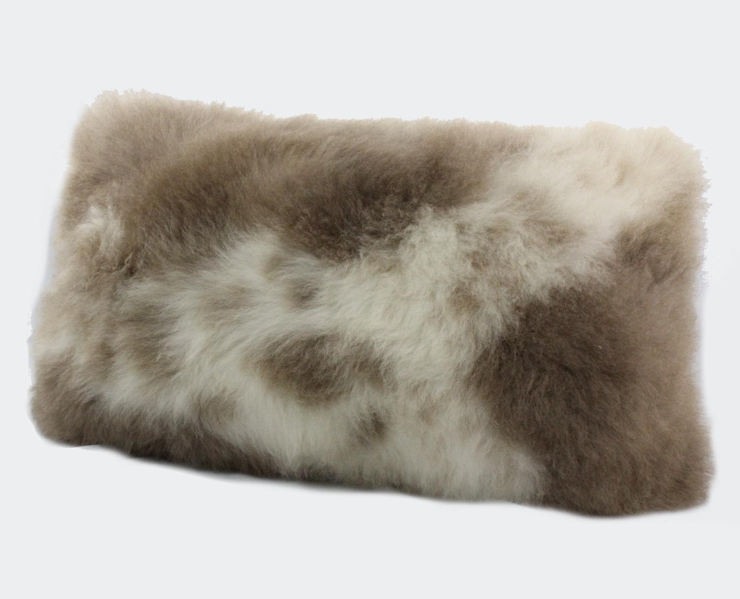 Create an atmosphere of luxurious comfort layering a bed or sofa with this alluring Albanian sheepskin pillow. A Limited edition piece with only one of its kind and never will there be another one like it. Hand-crafted from the finest Albanian