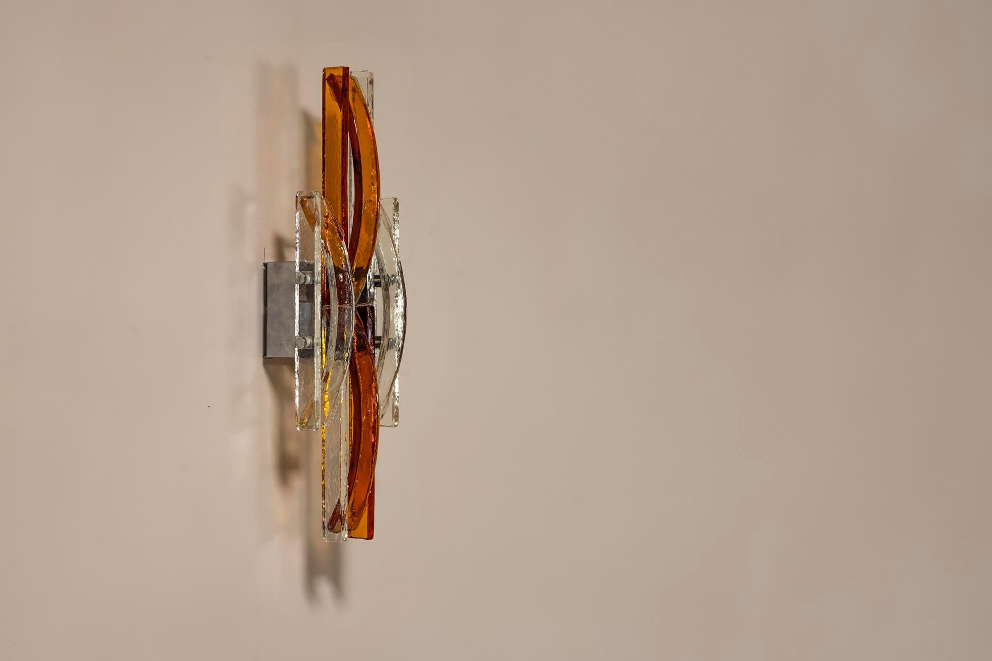 Albano Poli is a distinguished Italian designer renowned for his exceptional work with Murano glass. With a career spanning several decades, he decided to create Poliarte in the beginning of the seventies. Focussing on modern lamps made from Murano.