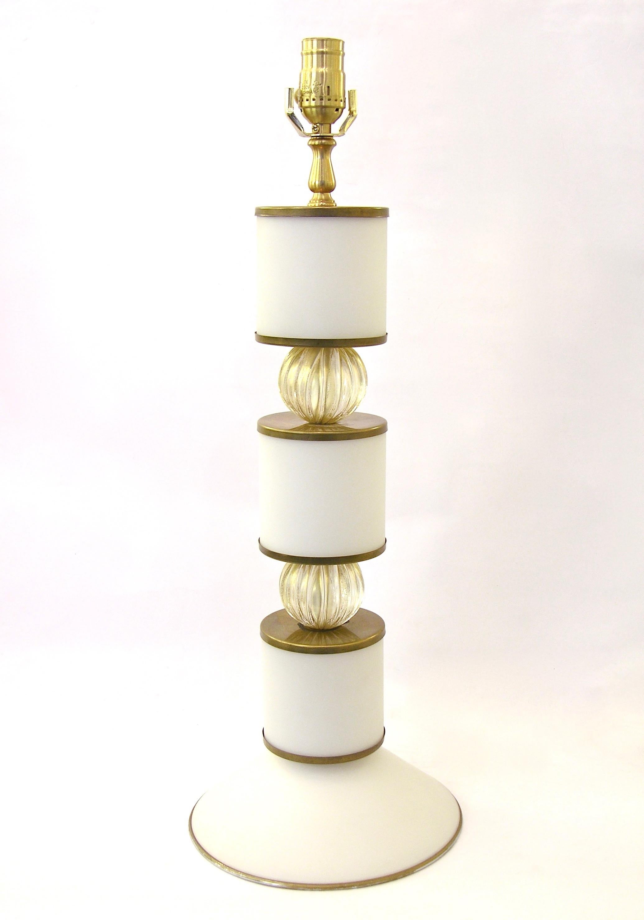 Elegant Italian pair of one-of-a-kind lamps by Albarelli. Chic design, displaying three Murano glass cylinders in opaline matte white with high quality edging in brass, divided by two fluted mouth blown glass spheres worked with pure gold and a