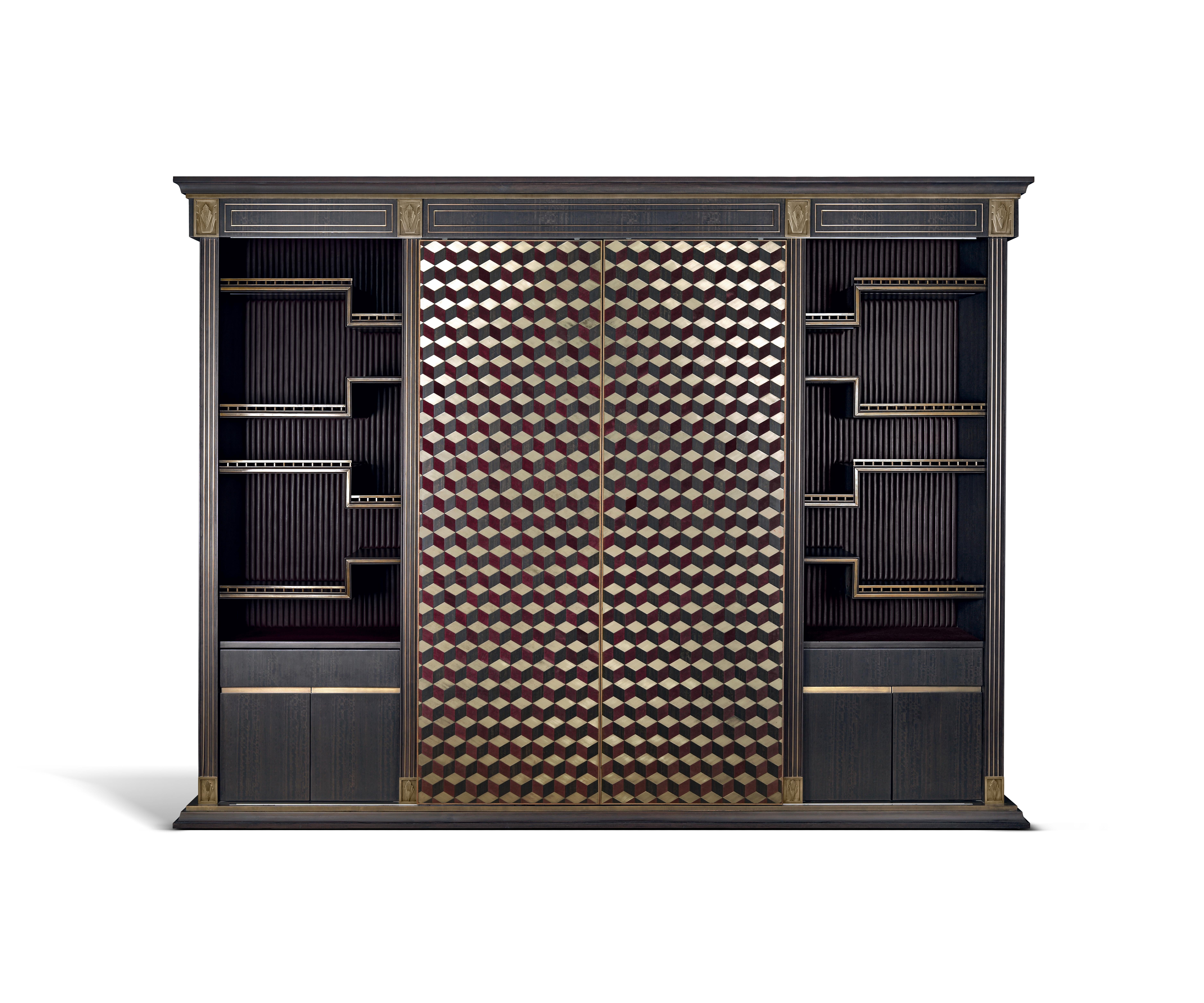 Der Barschrank Alber ist eine Studie über raffinierten Luxus, in dem reiche Texturen und kühne Geometrie zusammenkommen.

Umhüllt von geschmeidigem Leder und mit einer Fassade aus sorgfältig handfurniertem Holz, ist das Gitterwerk mit gebürstetem