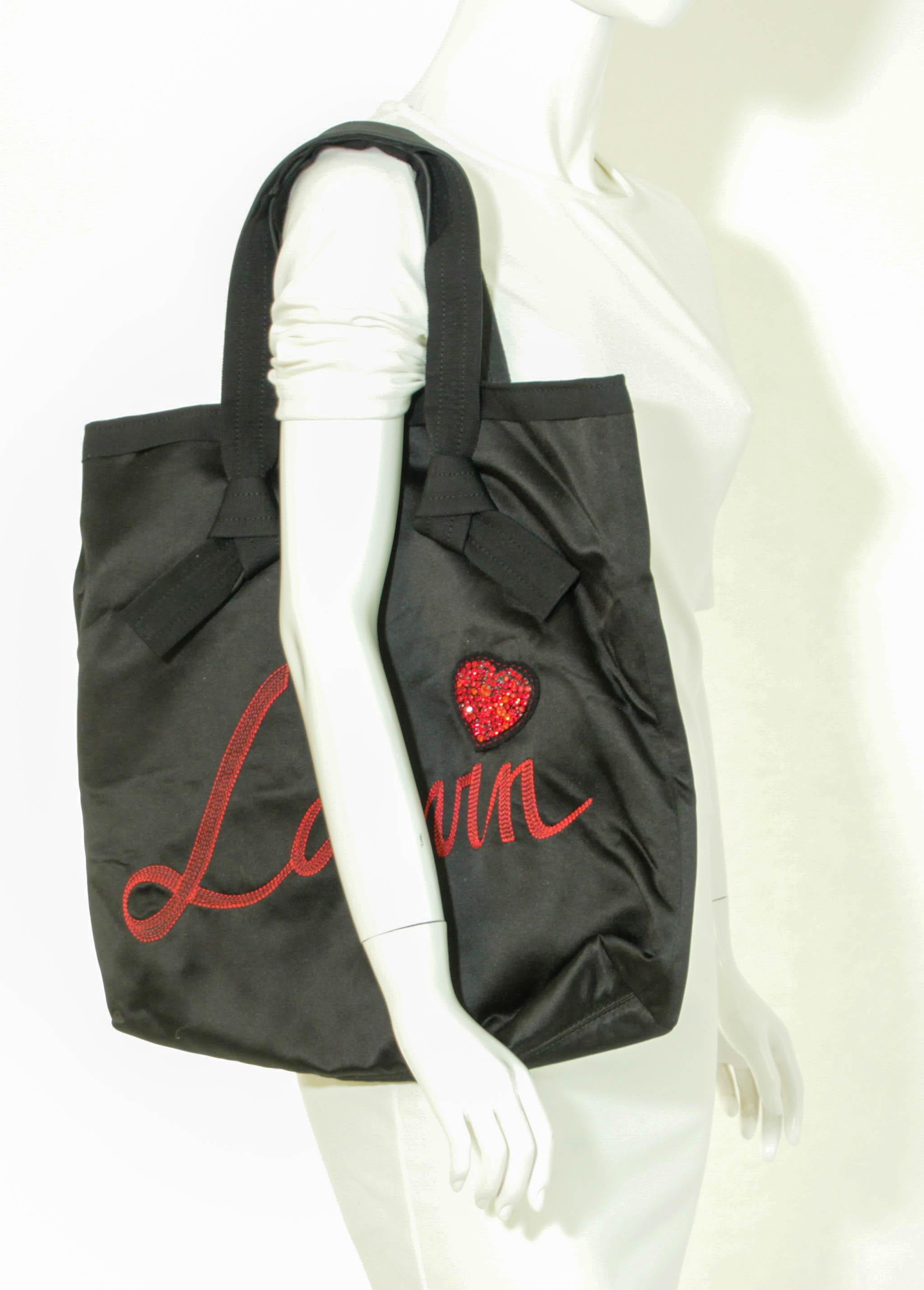 Lanvin Paris Black Tote Bag.
LANVIN embroidery red logo tote bag.
Magnificent Lanvin signature tote bag from the Alber Elbaz period In black fabric with Lanvin writing in red stitching and heart jewel sequins as a dot on the 