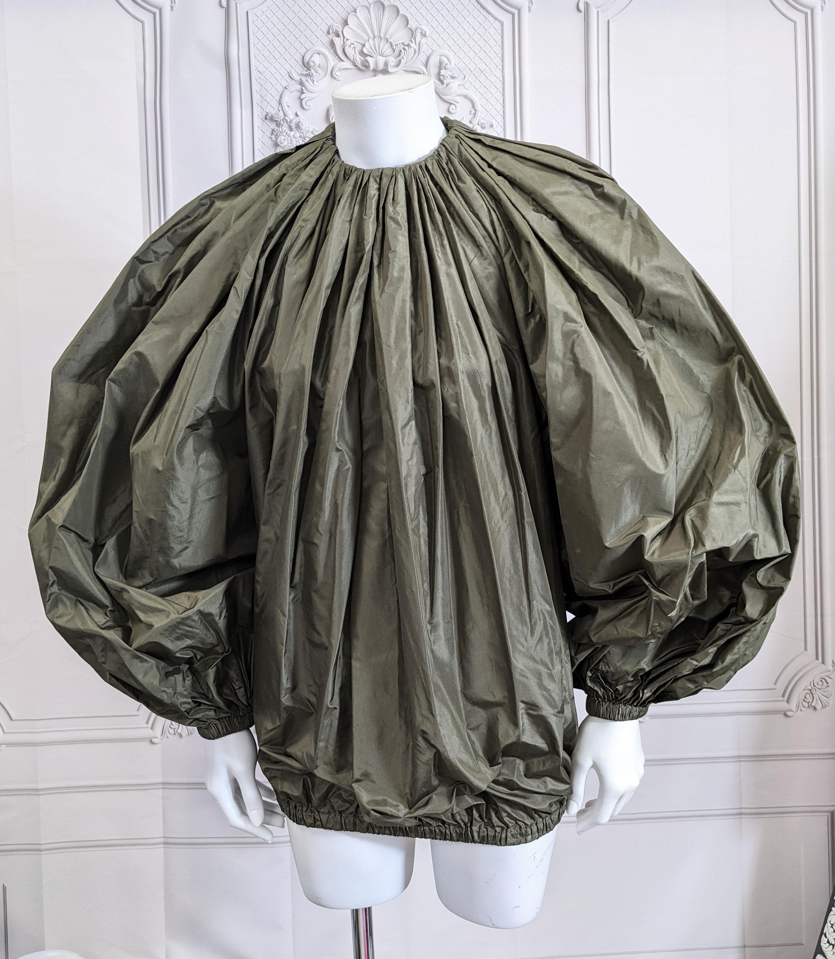 Alber Elbaz for Yves Saint Laurent A/H 2000 deep olive-brown paper tissue silk taffeta blouse with gathered neckline and oversized balloon sleeves. Elongated hip length blouse gathered at hem with elastic. Back is completely slit open but closed at