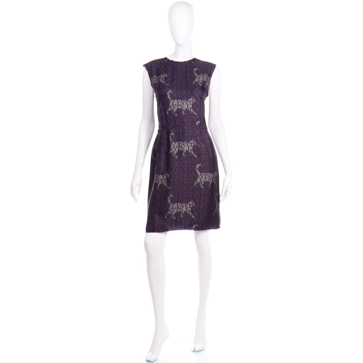 This is such a beautiful Lanvin silk dress with a monogrammed logo print and cat figure outlines. This dress would be easy to dress up for a special evening out or wear it with casual shoes for a lunch date! The base color is purple and the print is