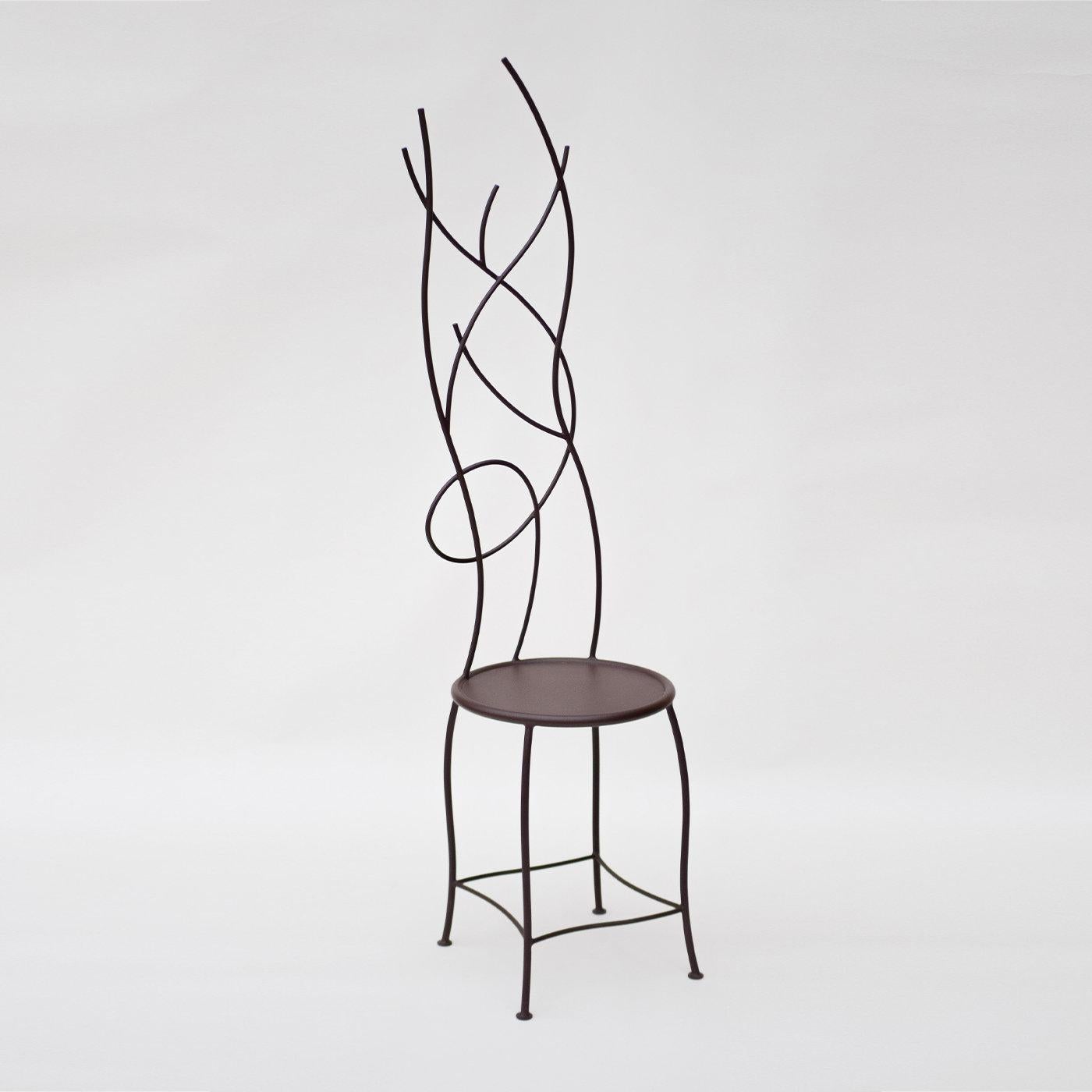 Brimming with undisputed sculptural flair, this rust-colored chair in wrought iron was deftly handcrafted to offer the illusion of sitting against a tangle of slender branches and twigs, the same branches crowning trees (