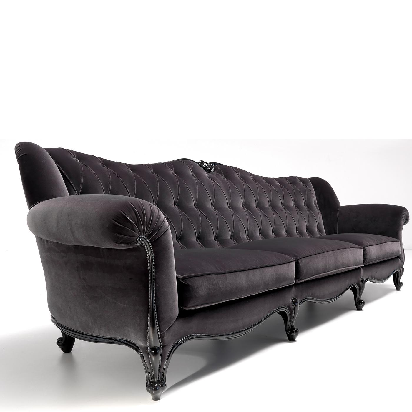 Exuding regal flair, this exquisite three-seater sofa will be a stunning piece to complement classic decors. An ultra-soft velvet upholstery in an intense dark hue covers the generously padded frame fashioned of solid durmast. The outward-curving