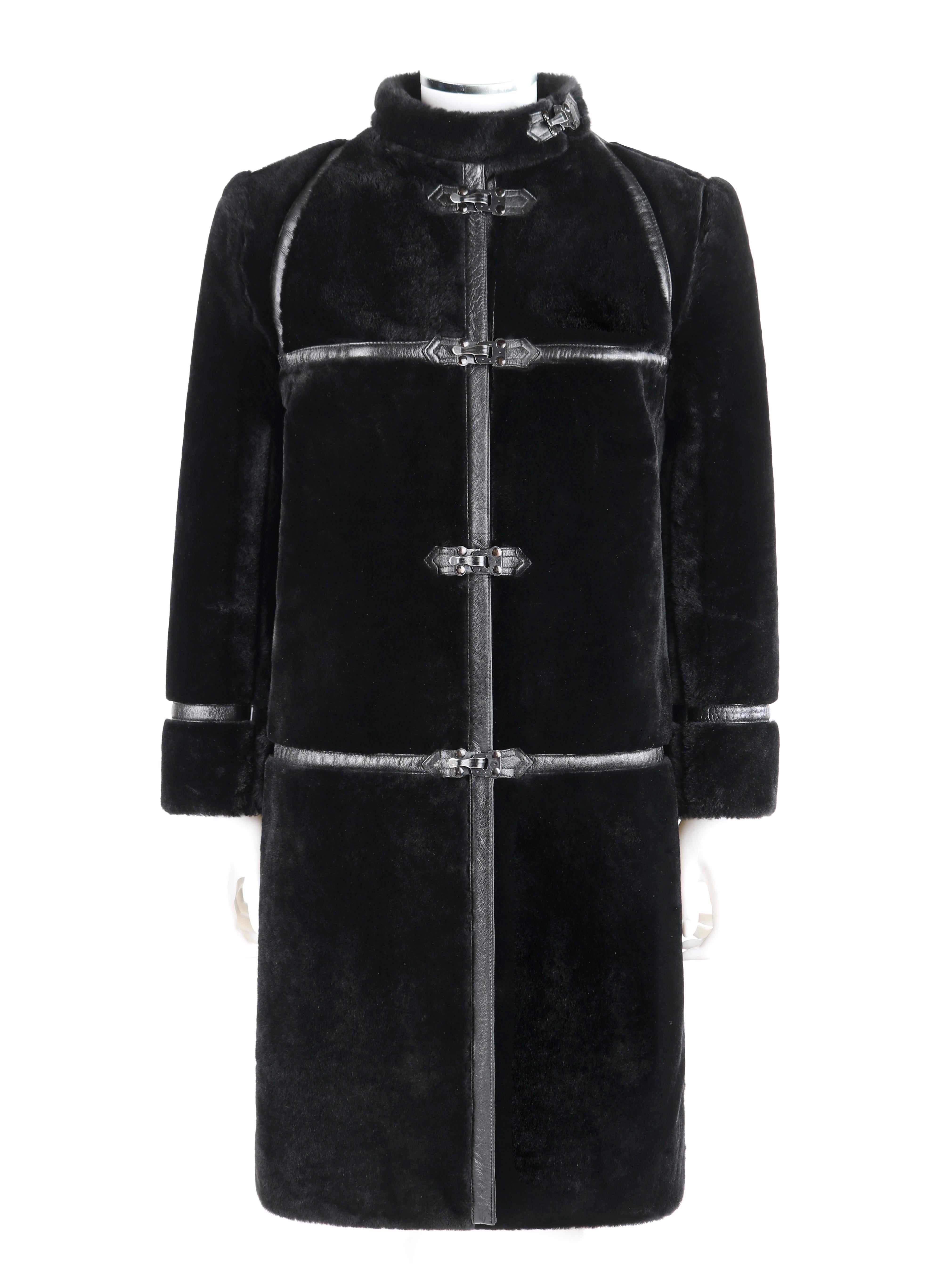 ALBERT ALFUS c.1960’s Black Shearling Fur Leather Trim Buckle Up Overcoat 

Circa: 1960’s
Label(s): Albert Alfus New York, Coplin’s Milwaukee, ILGWU Union tag
Designer: Albert Alfus
Style: Overcoat
Color(s): Black
Lined: Yes
Unmarked Fabric Content