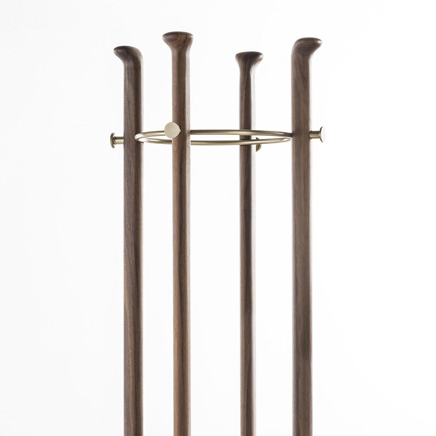 Coatrack Albert with solid walnut wood structure
and with brushed brass top structure. With Carrara
marble base.