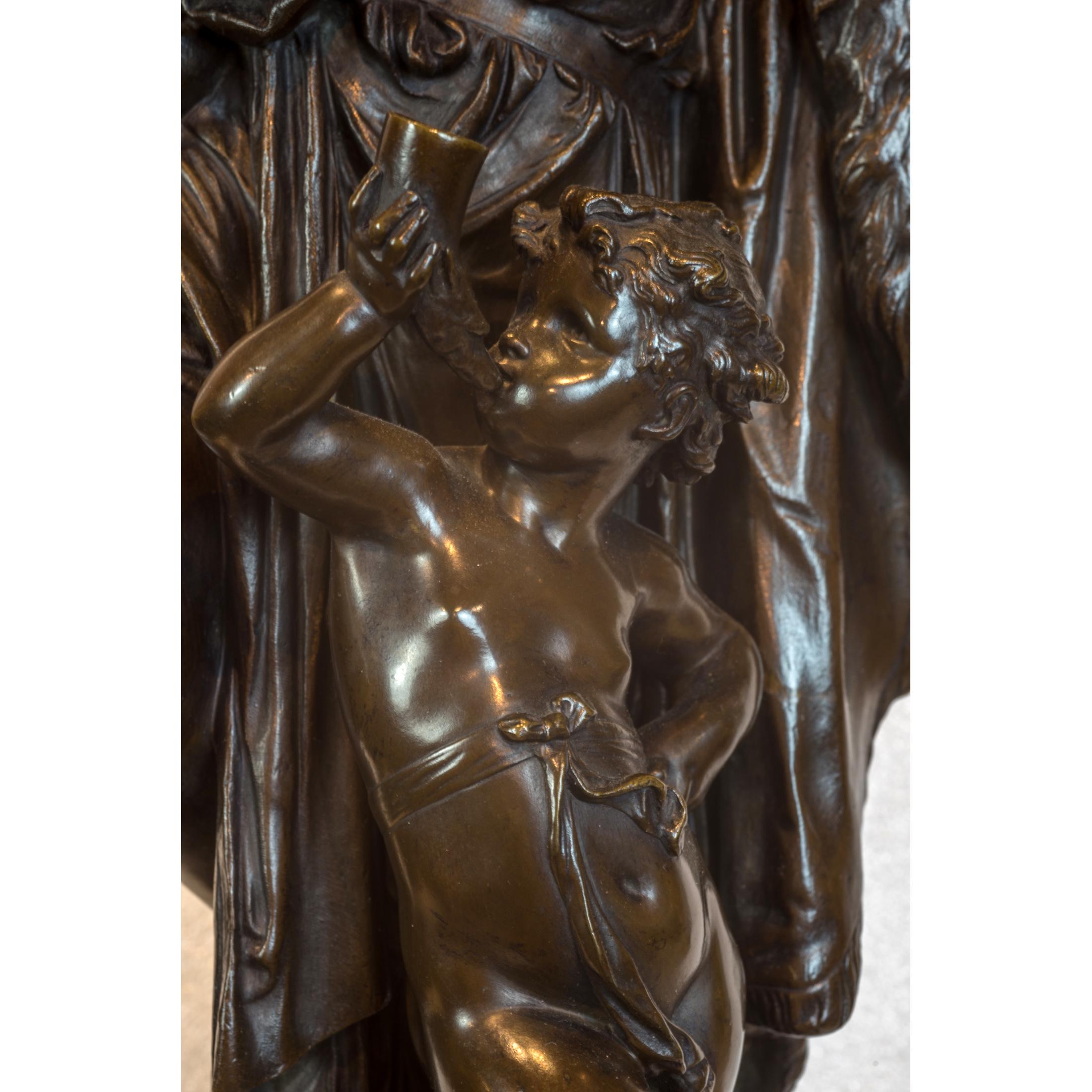 Modeled as a bacchanalian maiden holding aloft a bunch of grapes and a jug in the other, accompanied by a putto holding a horn cup, on square base, incised A. CARRIER-BELLEUSE, with applied title plaque to front.

Maker: Albert Carrier-Belleuse