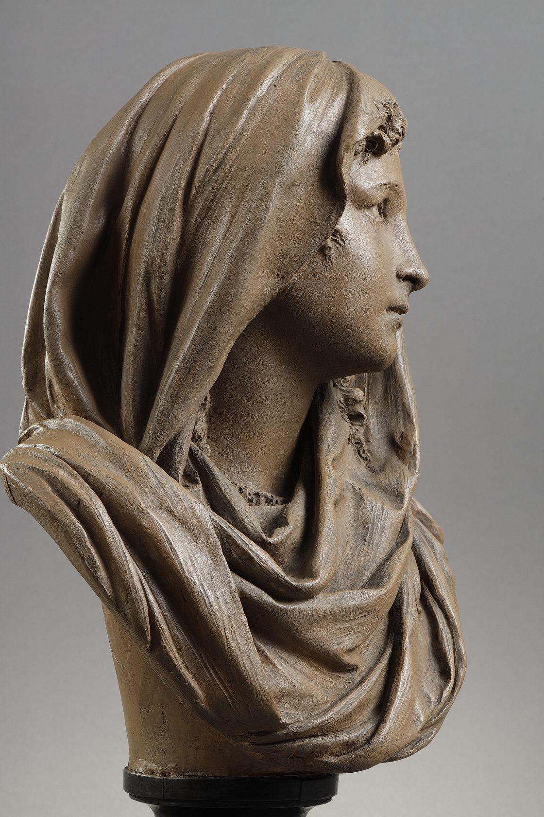 Bust of a young woman wearing a shawl
by Albert-Ernest Carrier-Belleuse (1824-1887)

Terracotta bust
Raised on a in blackened wood pedestal
signed 